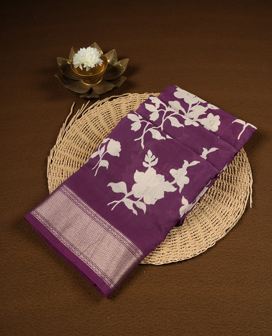 Purple colour Viscos semi printed saree featuring a light golden zari border, abstract white printed motifs on the body, and comes with a matching blouse