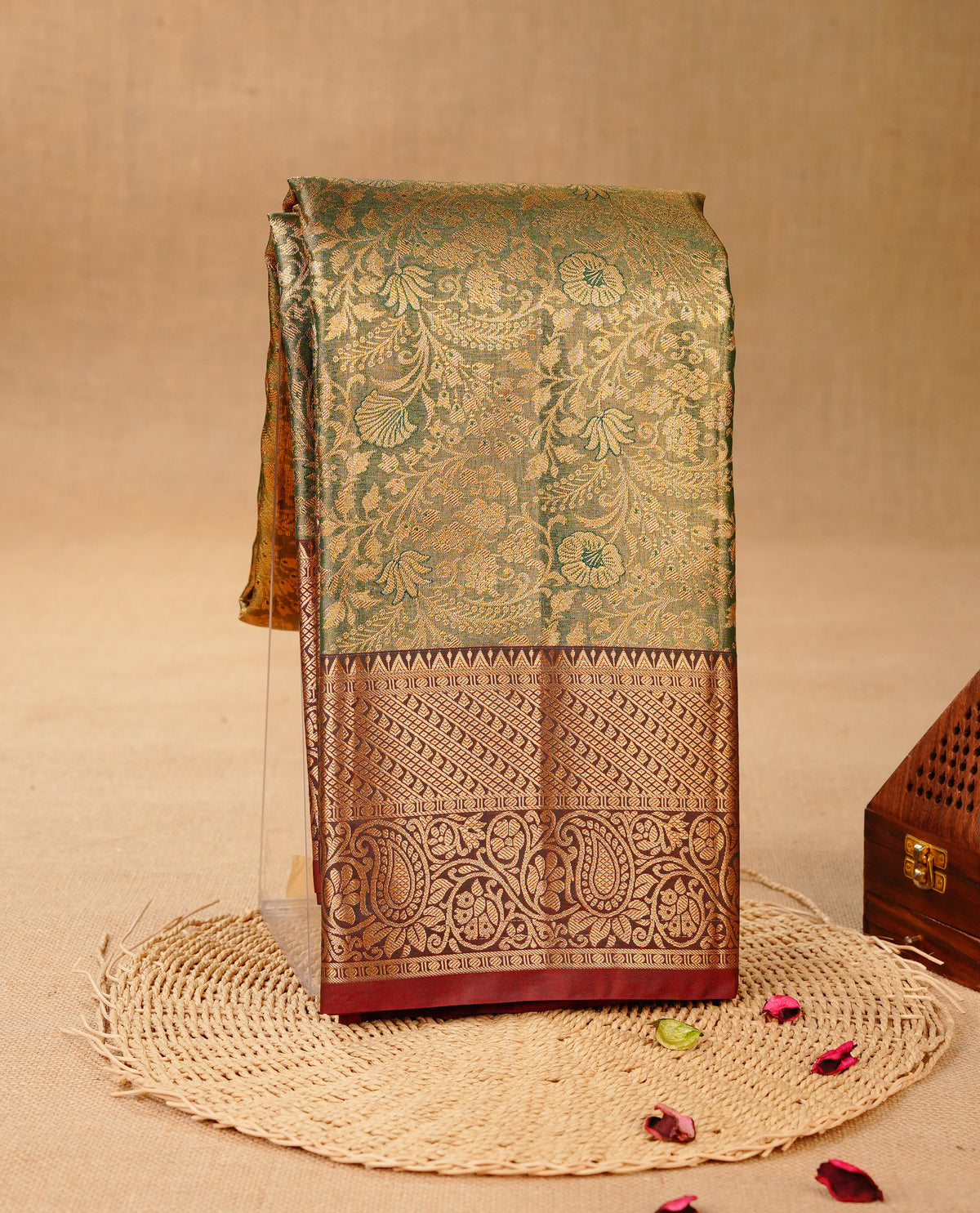 Green & Gold colour Double shade Semi tissue silk saree featuring Gold zari Floral pattern on body, Contrast Chocolate colour with Fancy border, paired with matching.