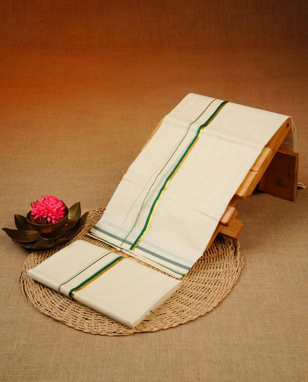 Cream colour cotton set mundu with plain body, featuring Gold zari & green simple kara.