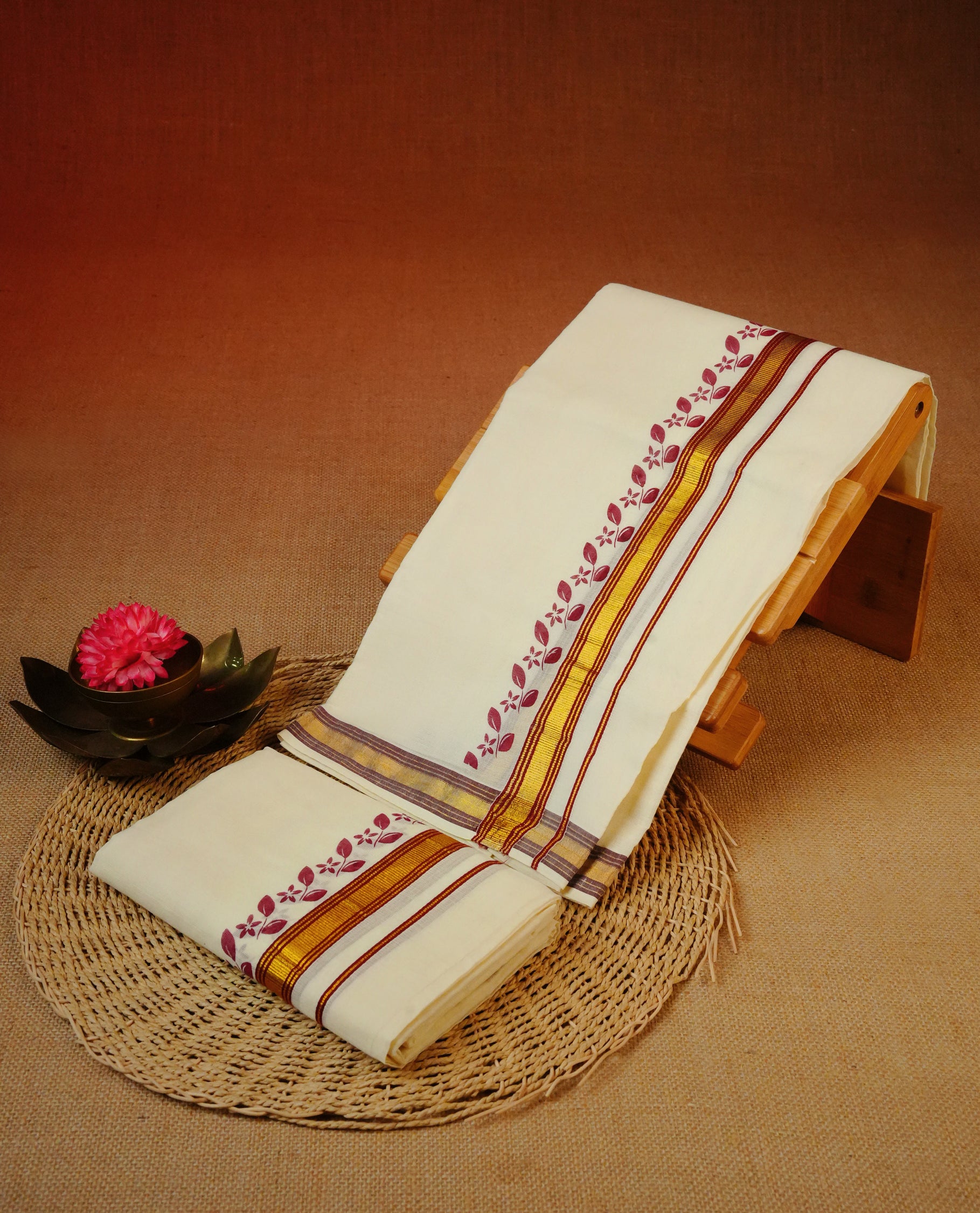 Cream colour Cotton set mundu With plain body, enhance gold zari with Maroon print & Maroon kara.