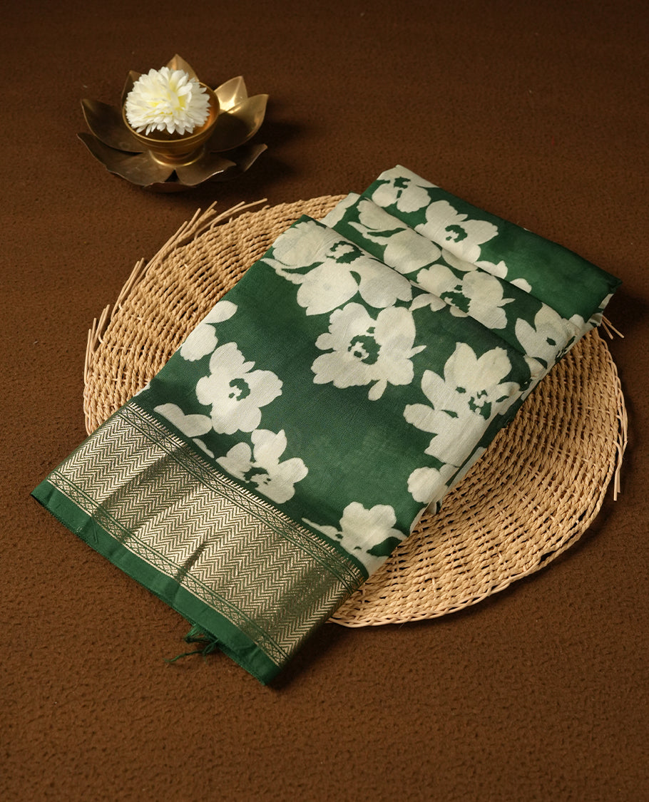 Green colour Viscos semi printed saree featuring a light golden zari border, abstract white printed motifs on the body, and comes with a matching blouse