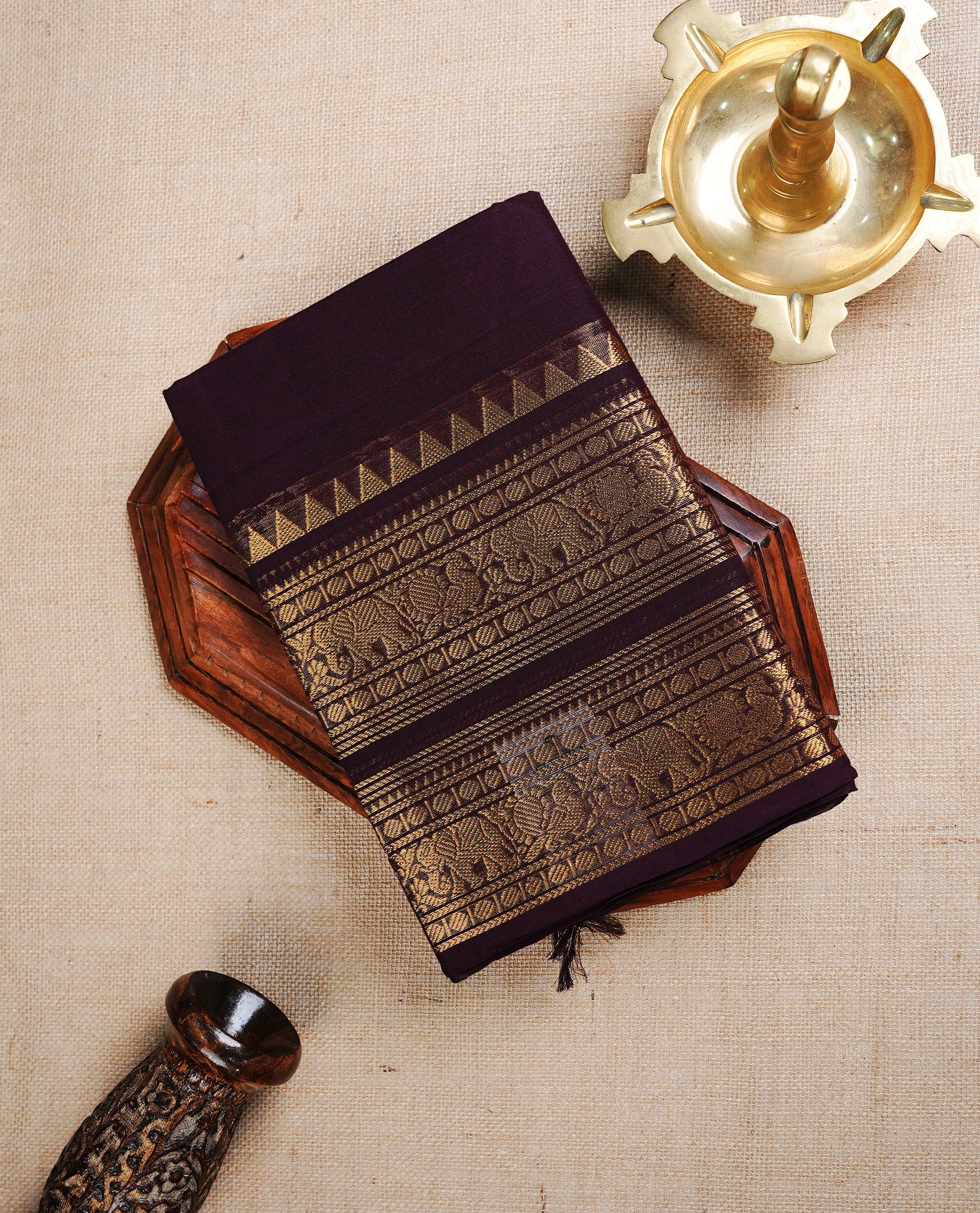 Dark Chocolate Brown colour chettinad cotton saree featuring Plain body, complemented by Traditional Gold Zari border, paired with matching blouse piece.