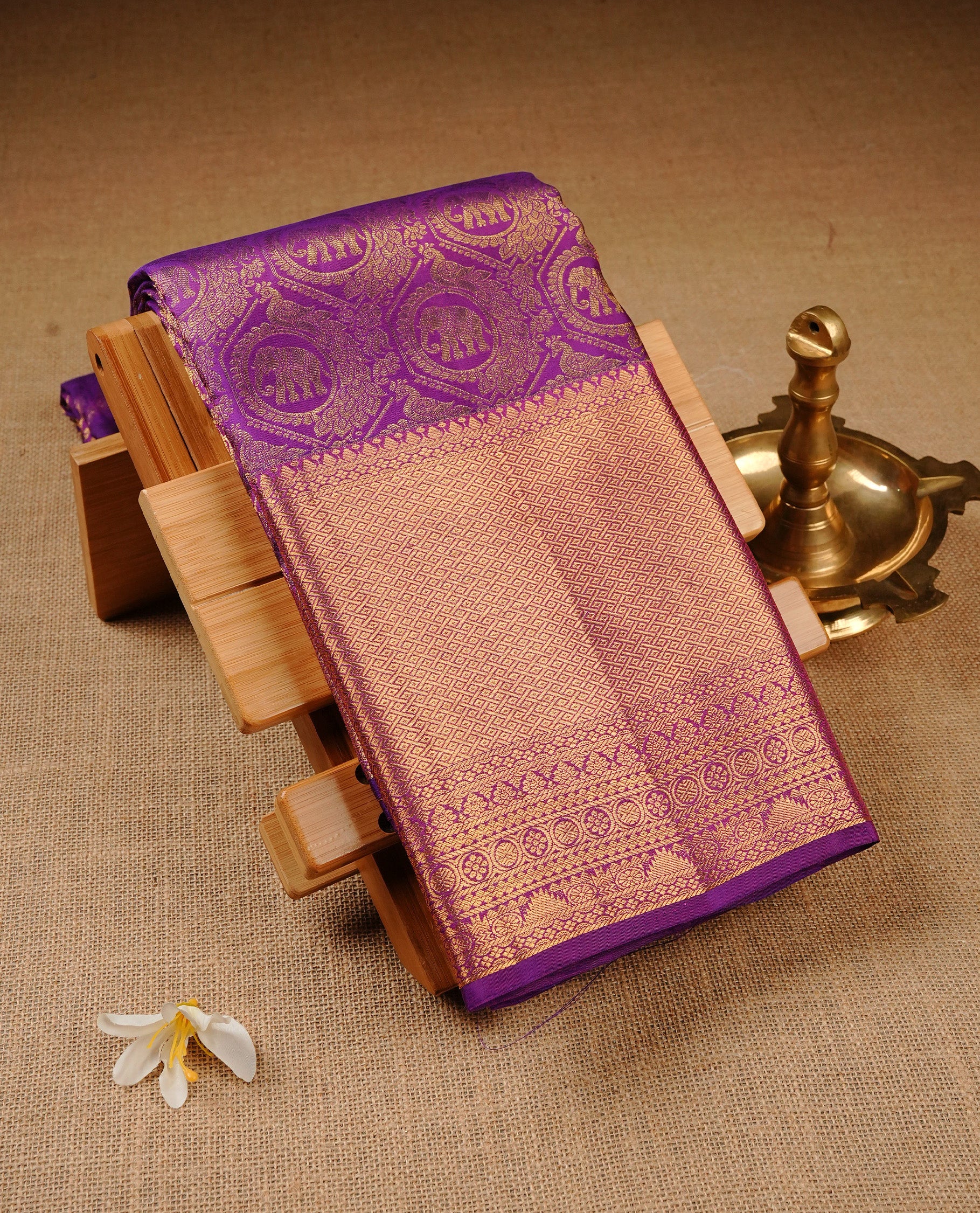 Violet Colour Pure Kancheepuram Silk Saree Featuring Gold Zari Elephant and Peacock In a Circle Pattern on the Body, Highlighting a Traditional Gold Zari Border, Paired with a Matching Blouse Piece.