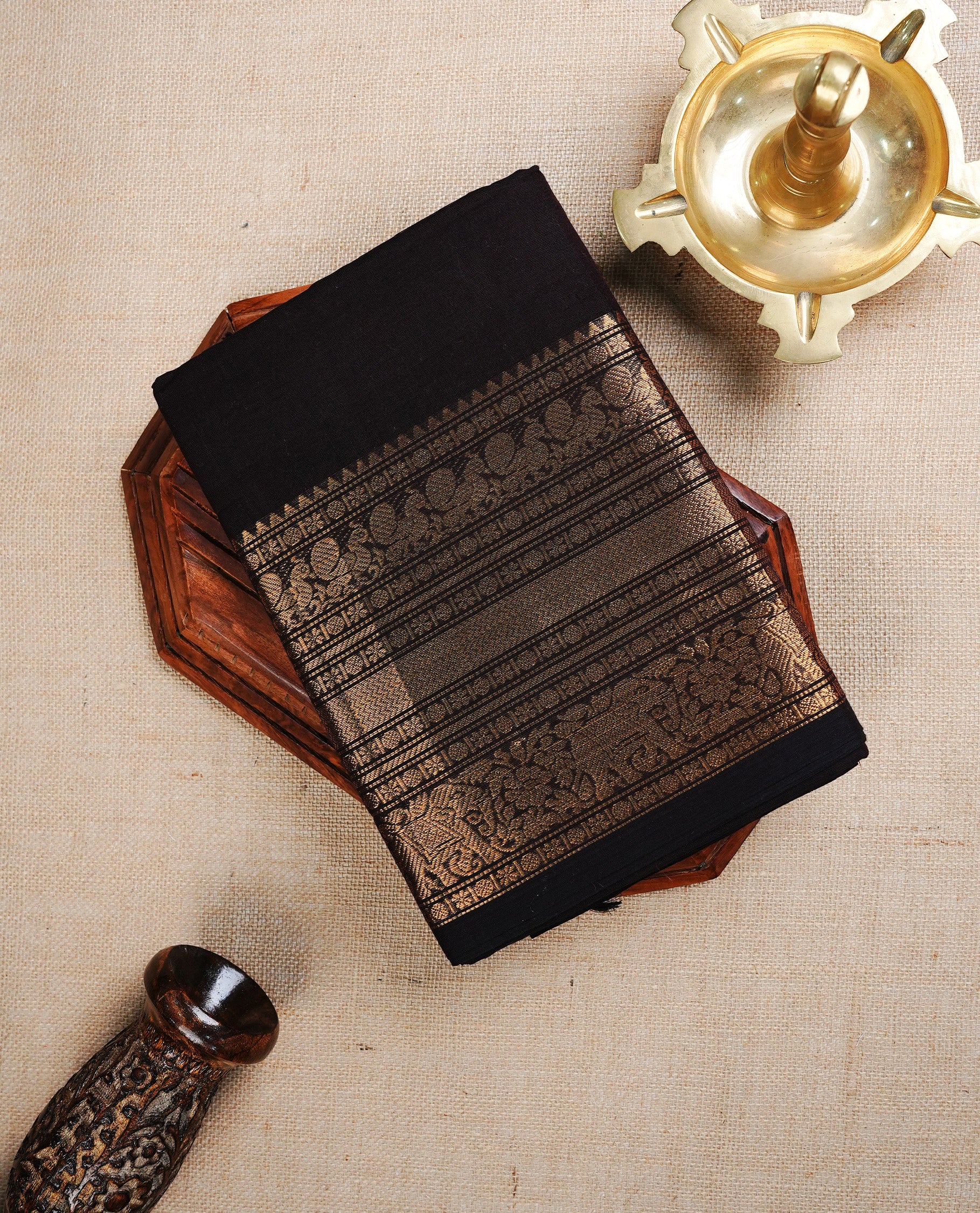 Dark Chocolate colour chettinad cotton saree featuring a Plain body, complemented by Contrast Colour With A Traditional Gold Zari border, paired with matching blouse piece.