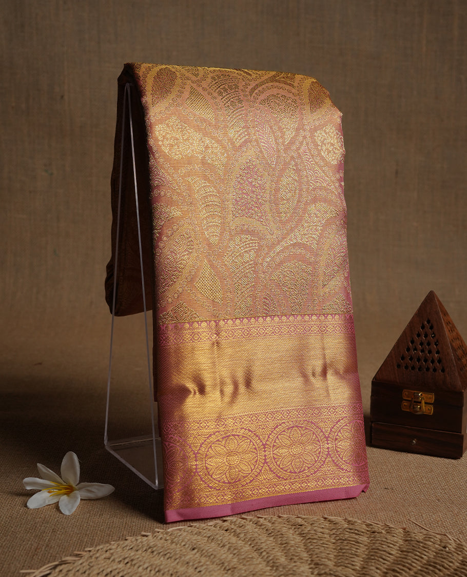 Pink & gold double shade colour kancheepuram tissue silk saree highlighting gold zari pattern body, with contrast Pink colour colour with traditional border and paired with matching blouse.