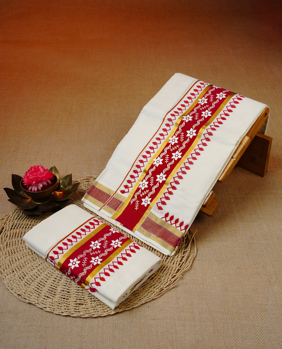 Cream colour cotton set mundu featuring gold with red printed kara.