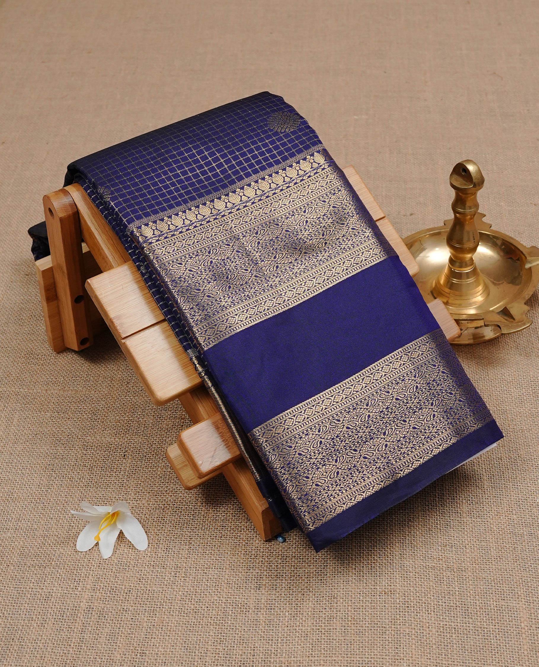Navy Blue Colour Wedding Silk Saree Featuring Gold zari check pattern on body, complemented by traditional Zari pattern on self colour border, paired with matching blouse piece.
