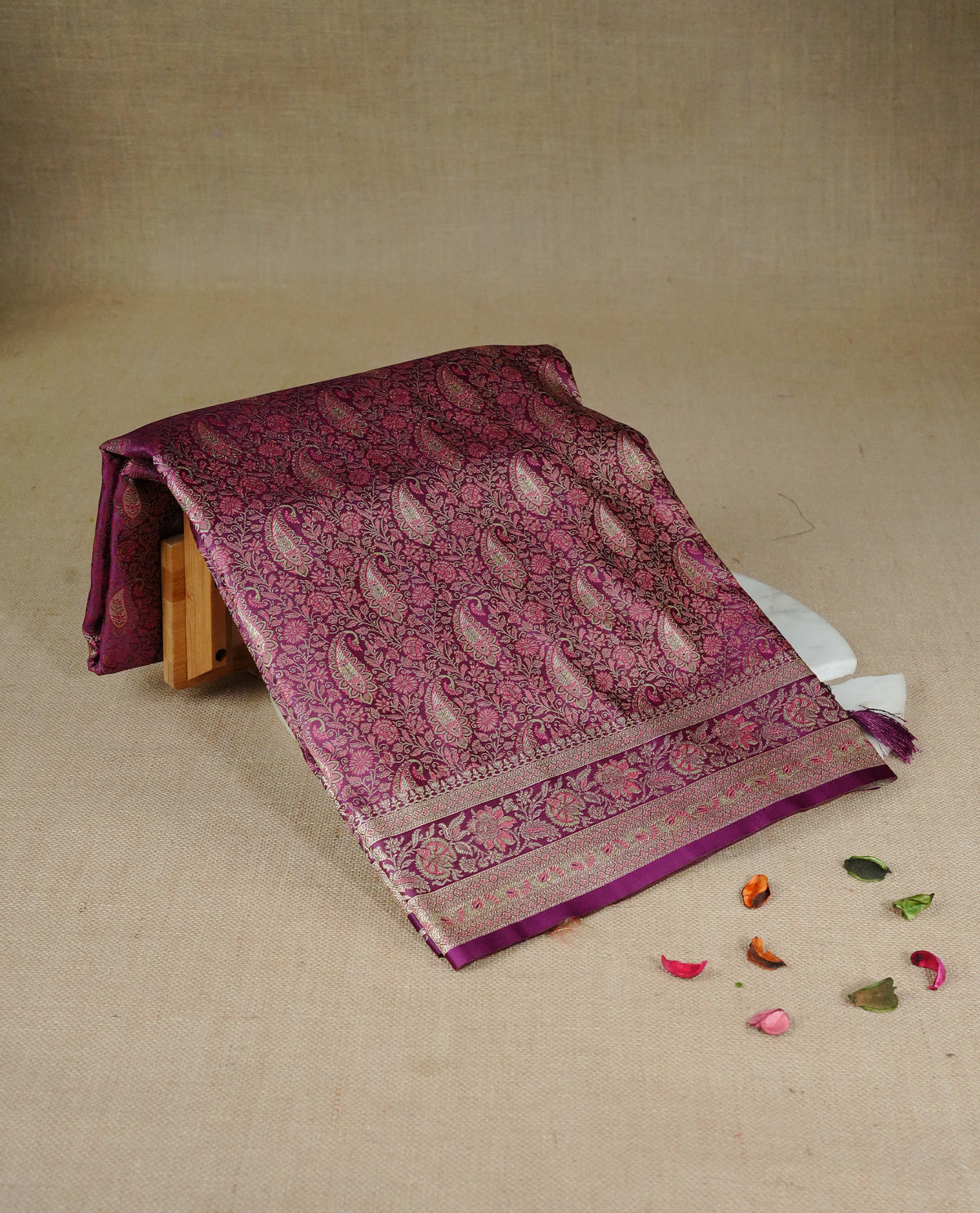 Deep purple colour Mulberry silk saree featuring gold zari Mango & floral kodi pattern across body, complemented by self colour border with gold zari work, comes with matching blouse piece.