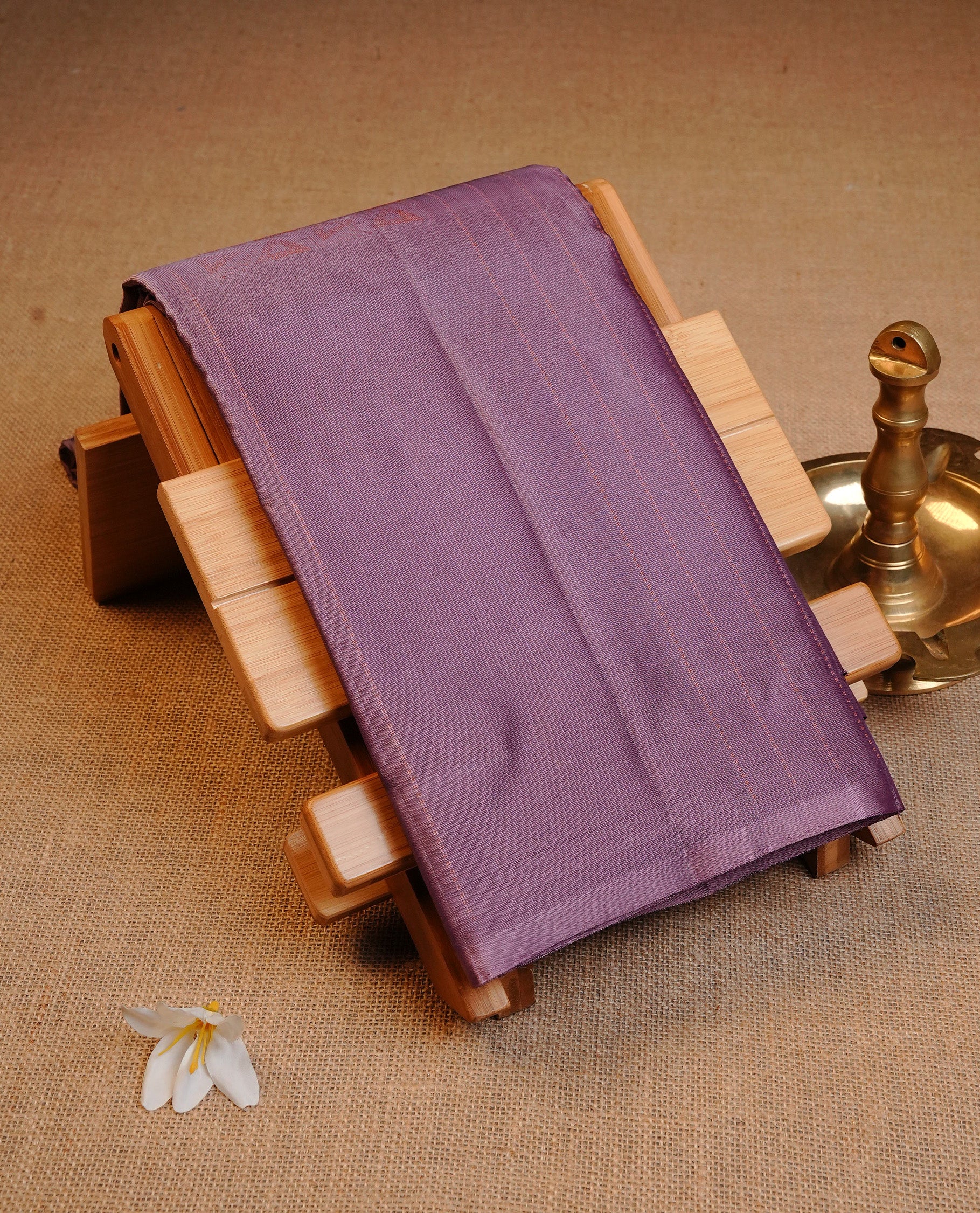 Lavender Colour Traditional Kancheepuram Silk Saree Featuring Gold Zari Stripes & Triangle Motifs on the Body, Designed Without a Border and with a Grand Pallu, Paired with a Matching Blouse.
