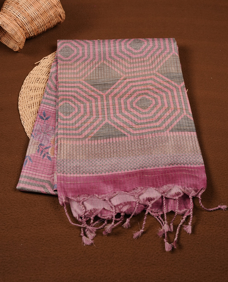 Pink colour semi tussar silk saree, featuring subtle hexagonal geometric patterns across the body, a textured pallu with fine detailing, and finished with a matching blouse.