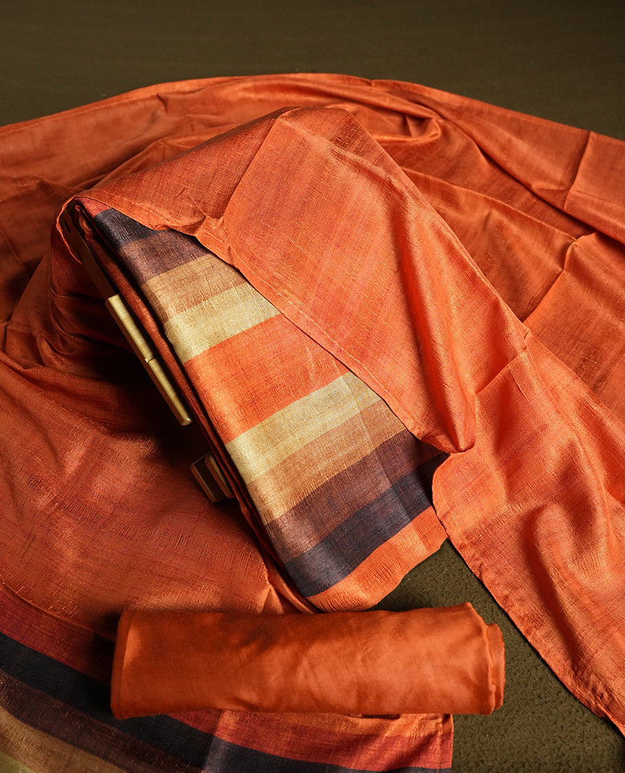 Orange colour churidhar material featuring elegant horizontal stripes on the yoke and dupatta, woven in shades of Brown and Orange & Paired with a matching plain bottom