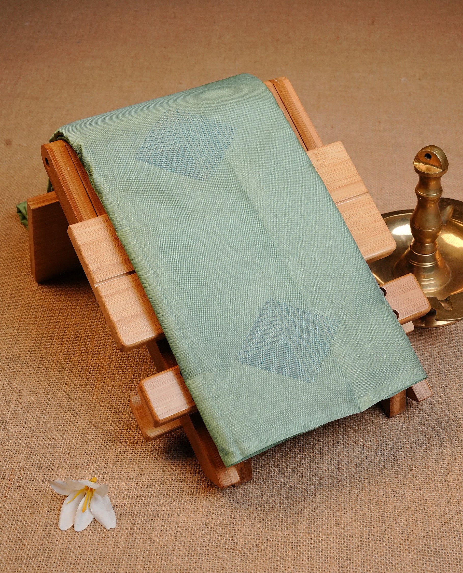 Mint Green Colour Traditional Kancheepuram Silk Saree Featuring Blue Zari Diamond Motifs on the Body, Designed Without a Border and with a Grand Pallu, Paired with a Matching Blouse.