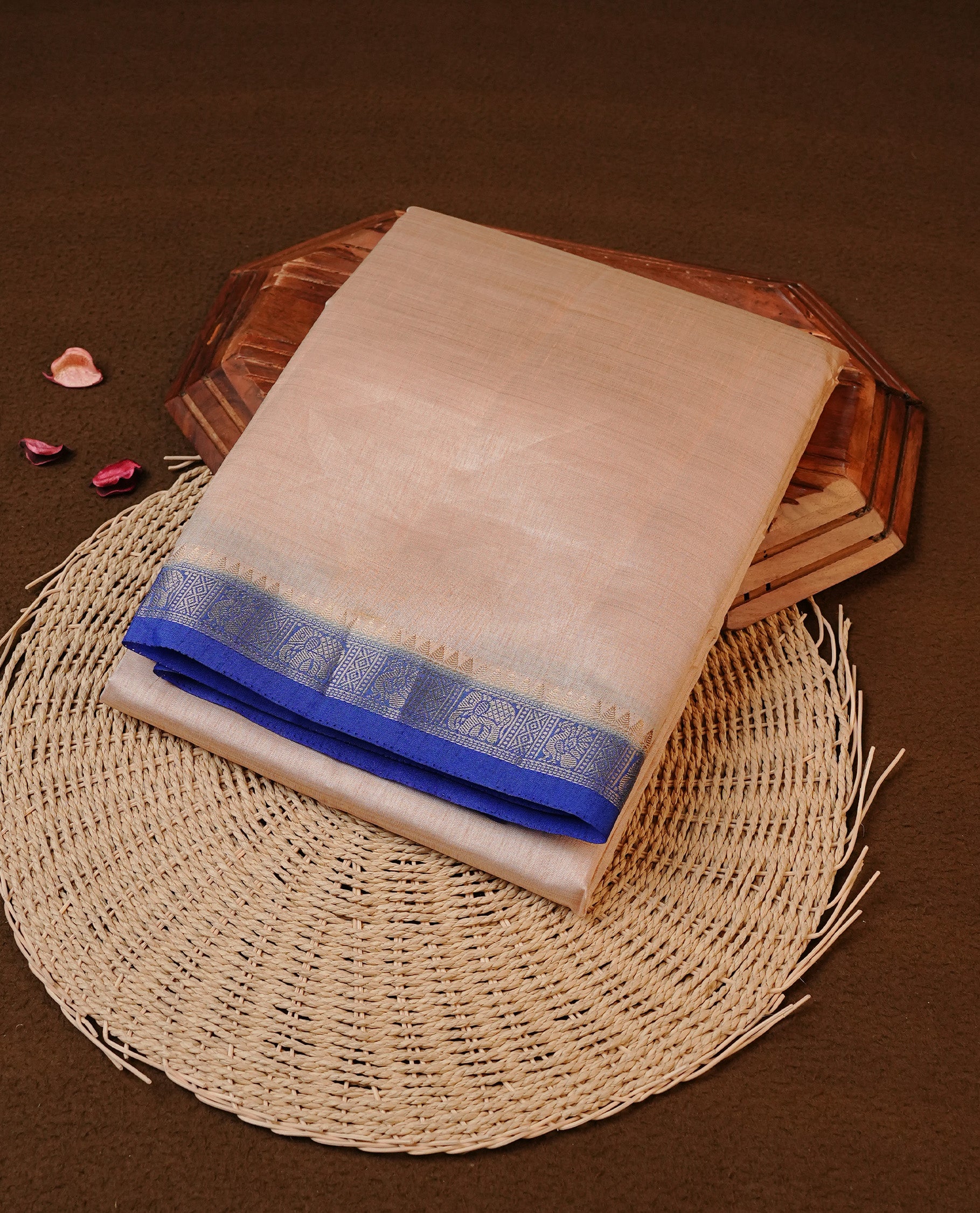 Cream colour Tussar silk saree Featuring Elegant Plain body, complemented by Contrast Blue colour with gold zari border, paired with matching blouse piece.