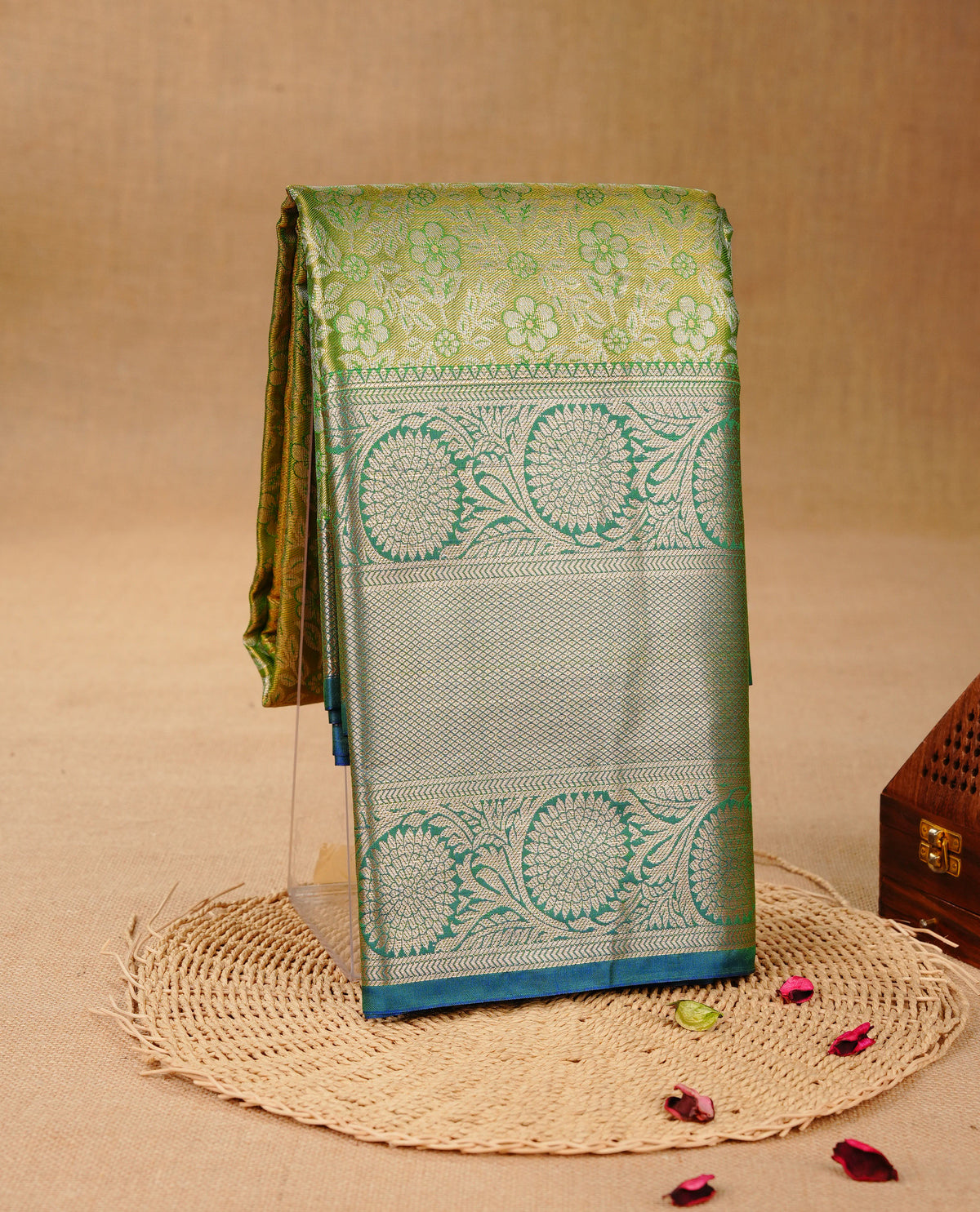 Green & Gold colour Double shade Semi tissue silk saree featuring self color Floral pattern on body, Contrast Light Green colour with Fancy border, paired with matching.