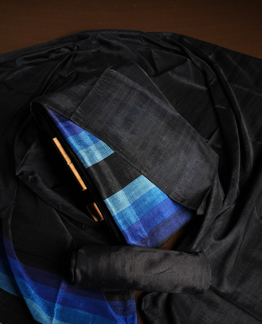 Black colour churidhar material featuring elegant horizontal stripes on the yoke and dupatta, woven in shades of Blue and Black & Paired with a matching plain bottom