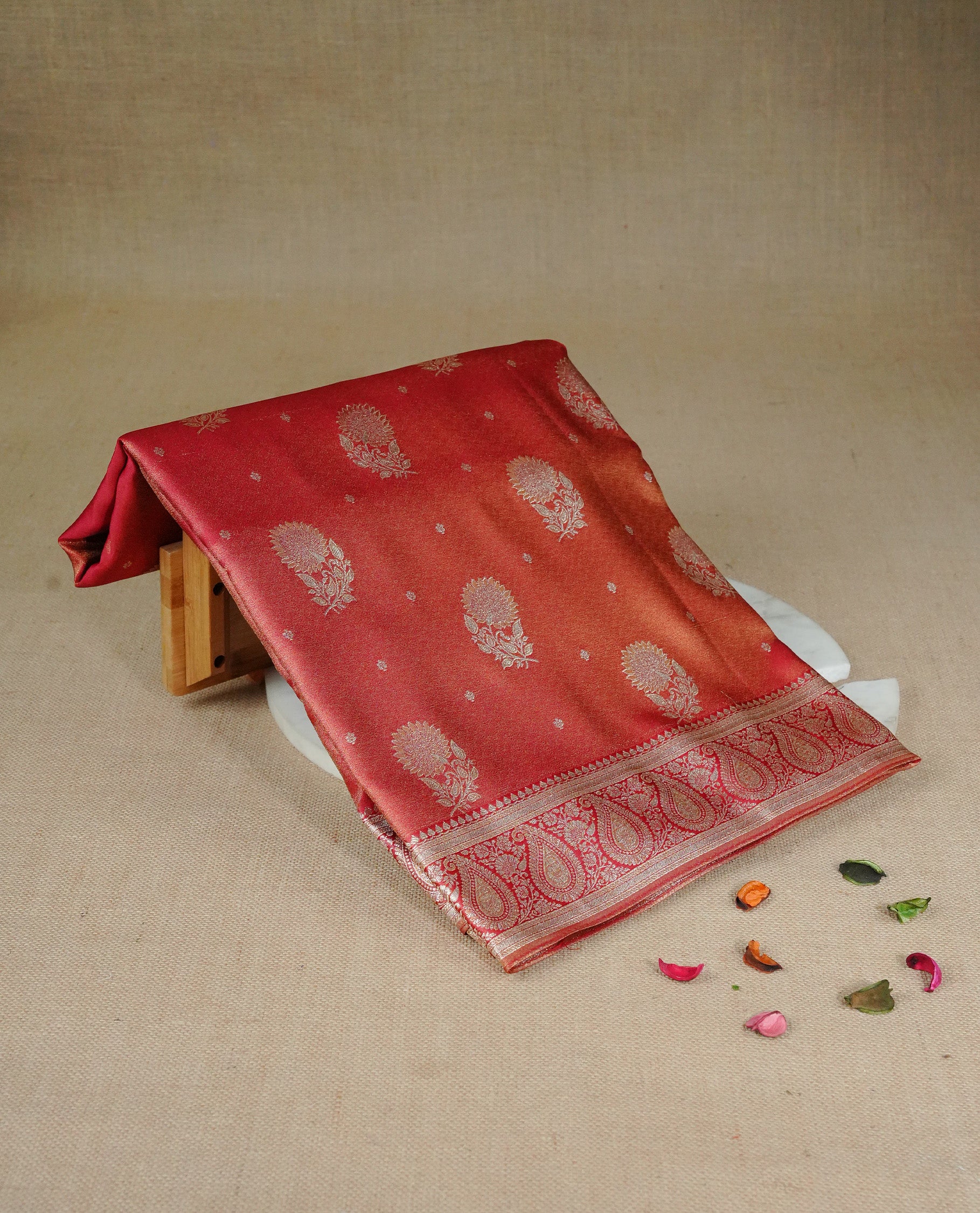 Red colour Mulberry silk saree featuring Gold zari small buttas & floral motifs on body, complemented by self colour with Gold zari border, comes with matching blouse piece.