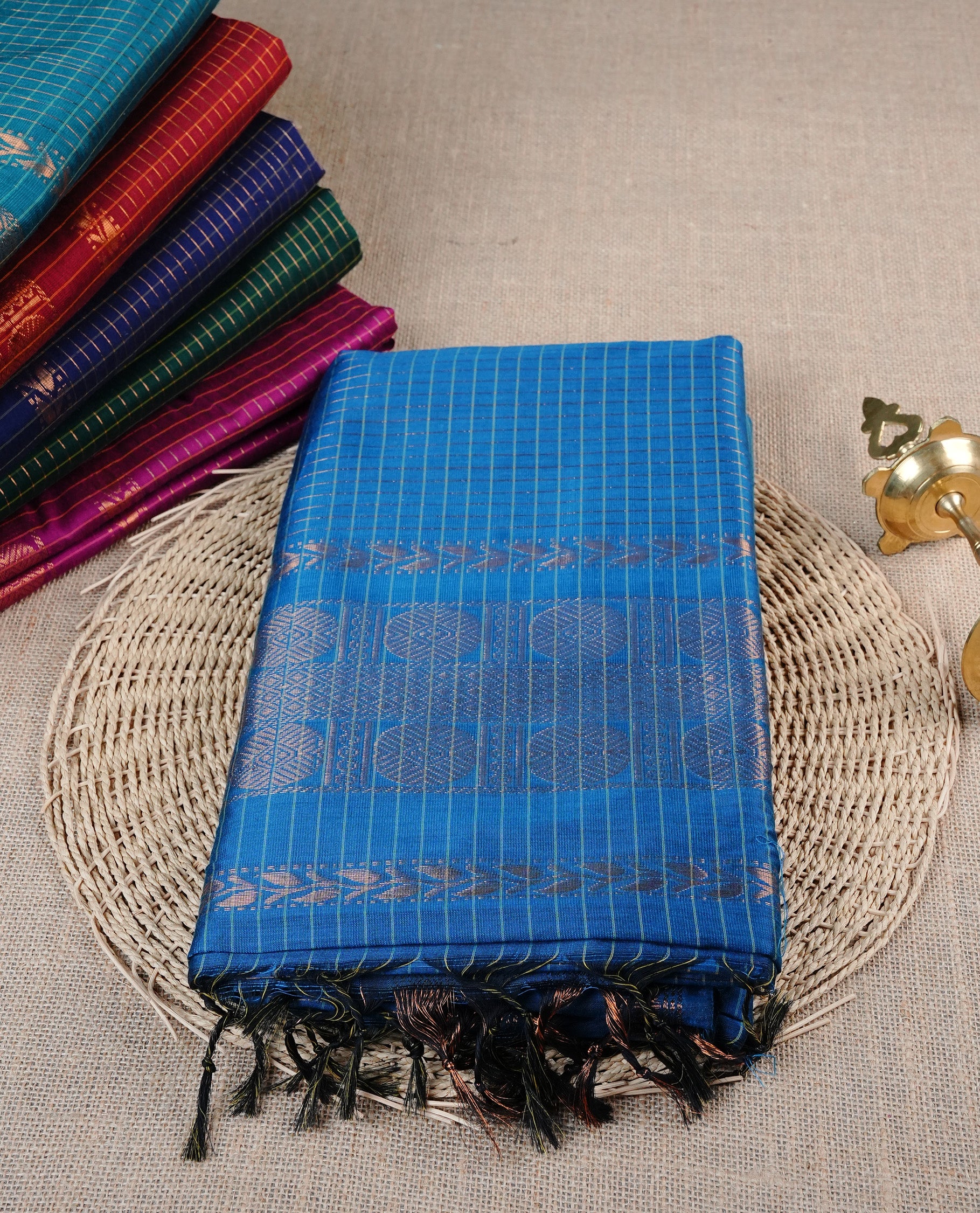 Light Blue colour Kalyani cotton saree featuring Gold zari checks on body, enhanced with zari border and grand zari pallu, comes with self colour blouse piece.