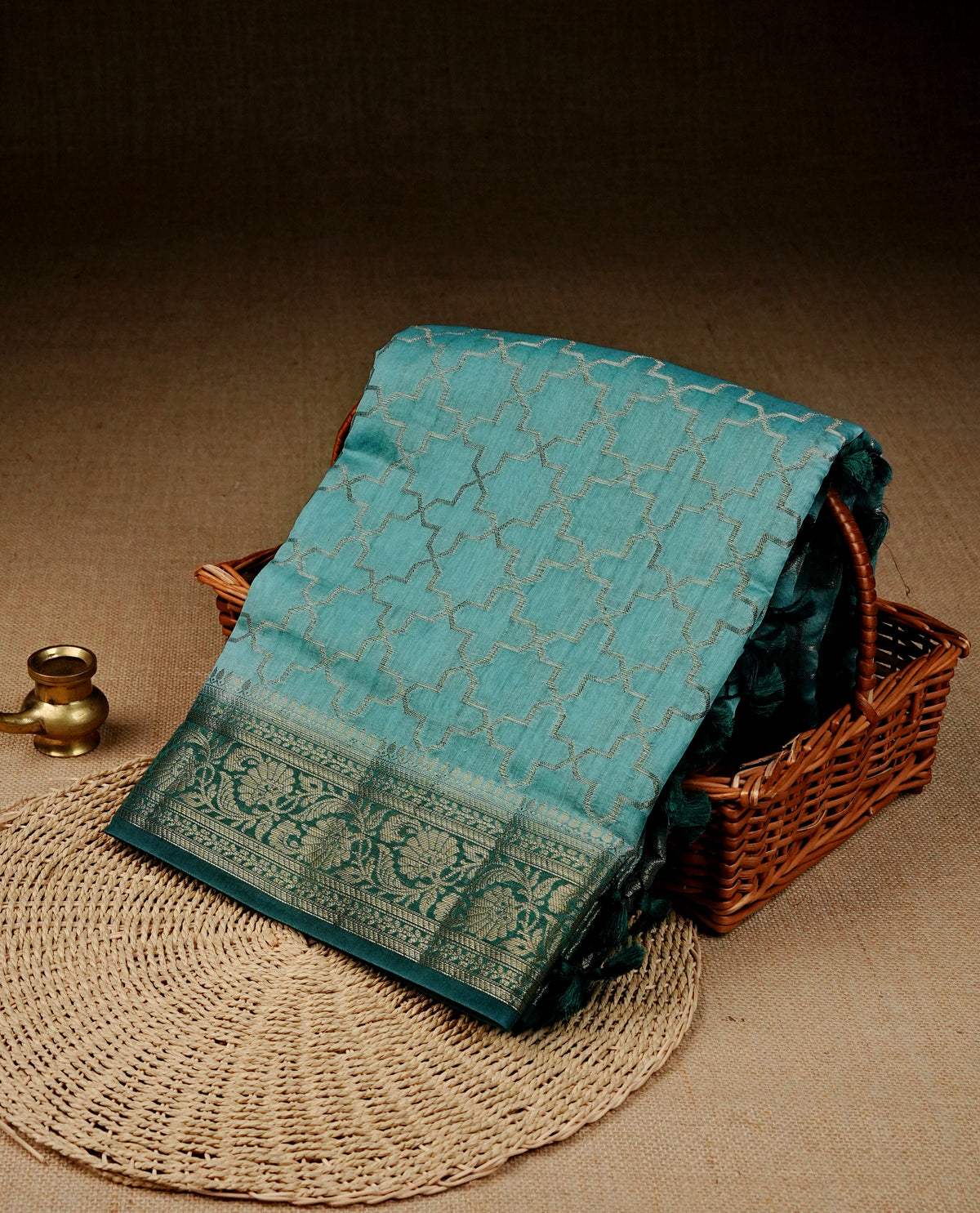 Blue colour Banaras silk saree featuring gold zari Geometric pattern on body, complemented by contrast Teal colour with zari border, comes with matching blouse piece.