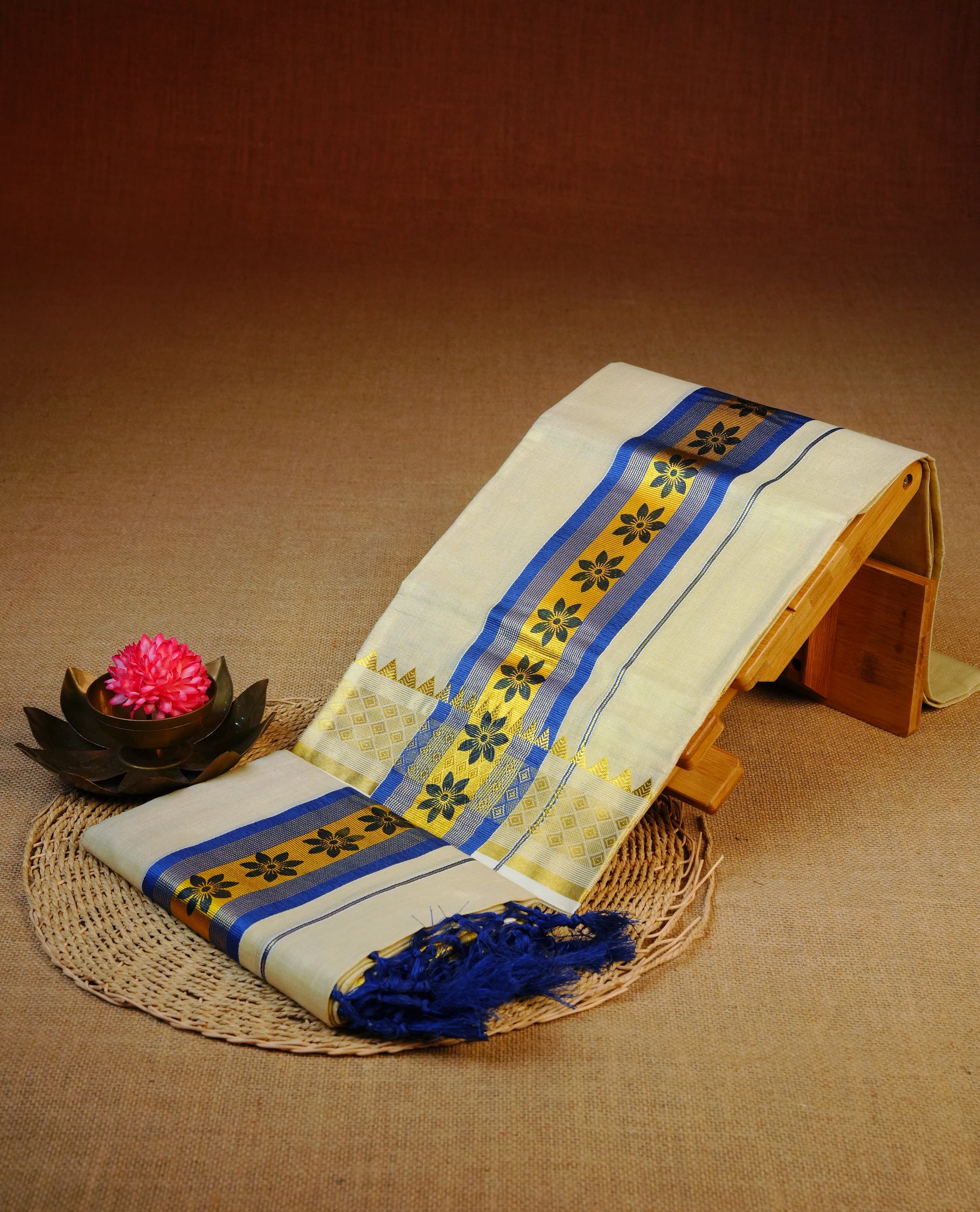 Light gold Tissue Set mundu featuring Blue floral print on gold kasav kara.