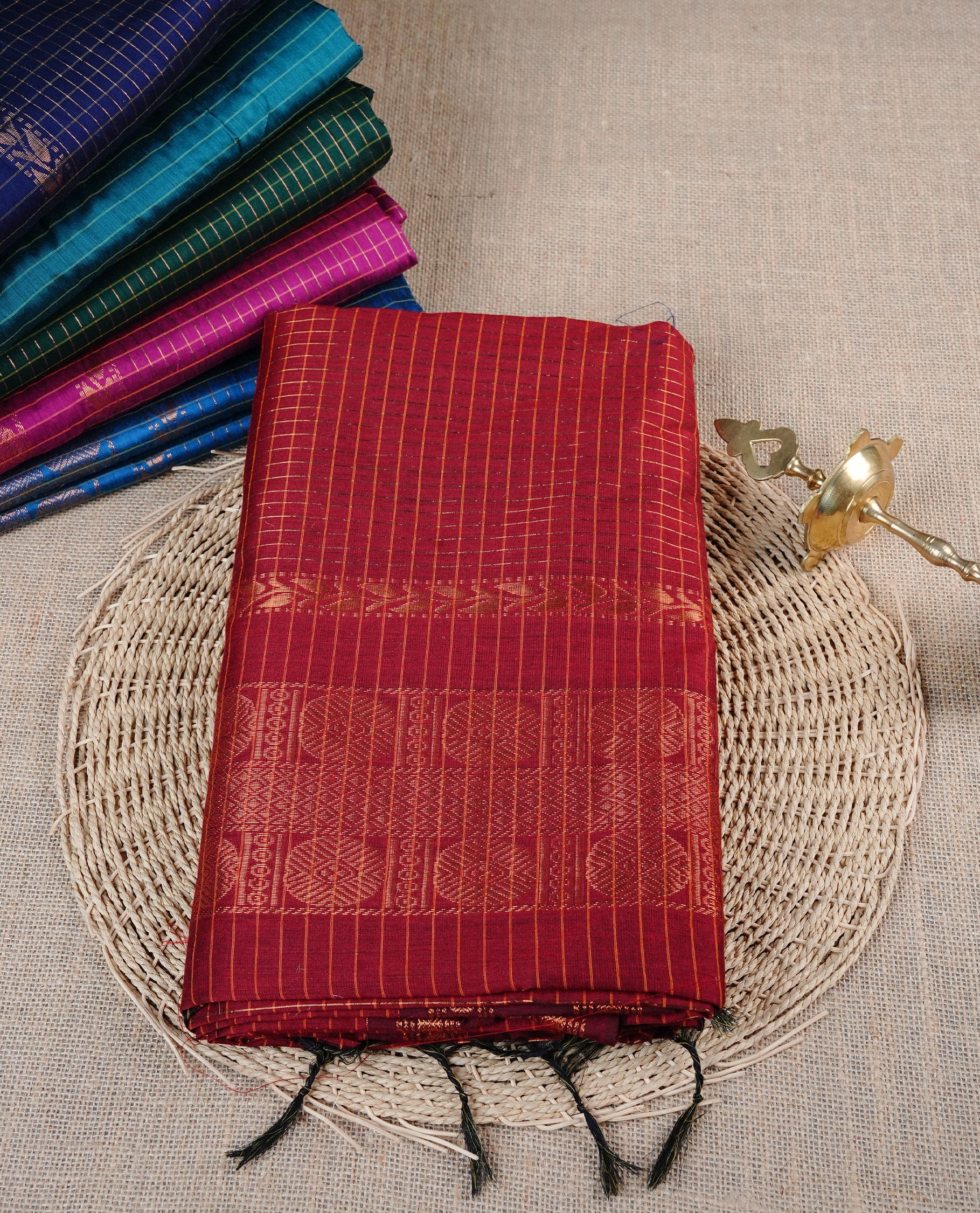 Red colour Kalyani cotton saree featuring Gold zari checks on body, enhanced with zari border and grand zari pallu, comes with self colour blouse piece.