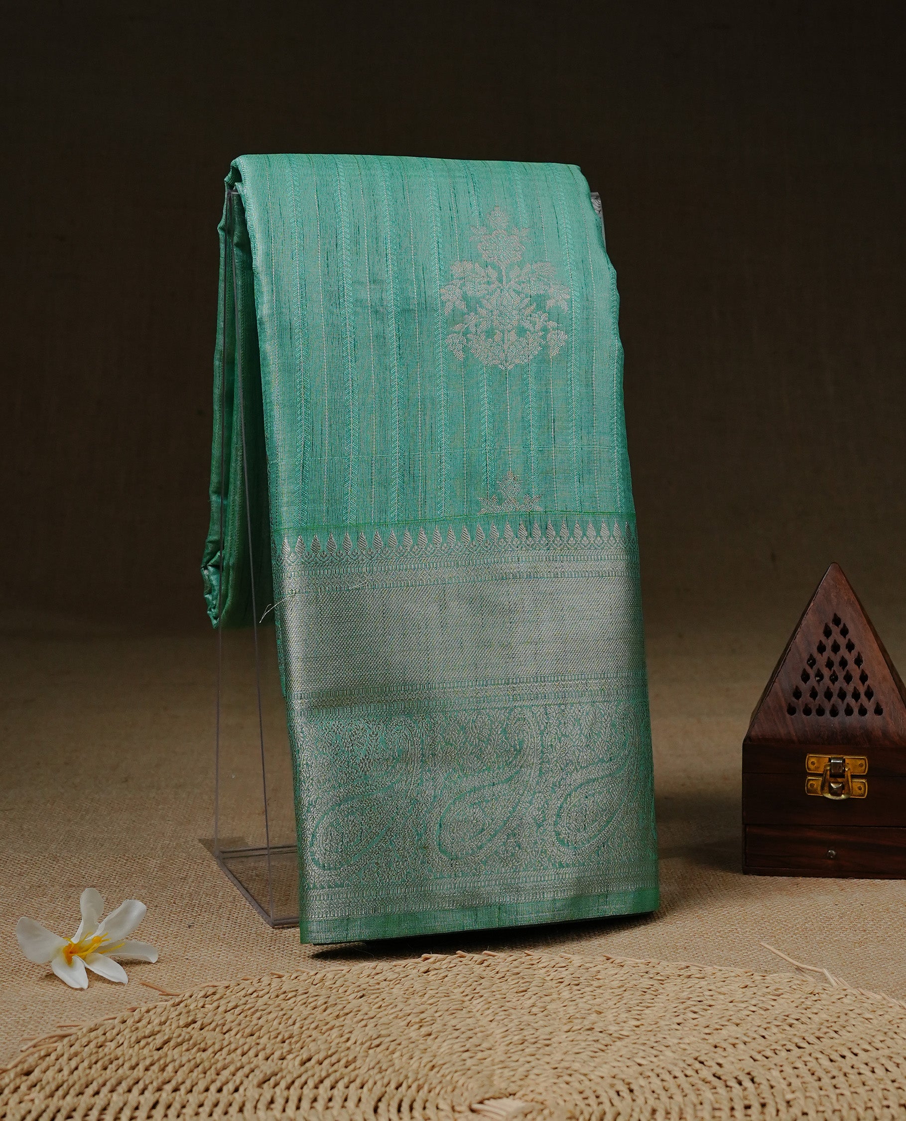 Aqua Green colour Tissue saree featuring Light gold Stripes With motifs on body, enhanced with self colour with traditional border, paired with matching blouse piece.
