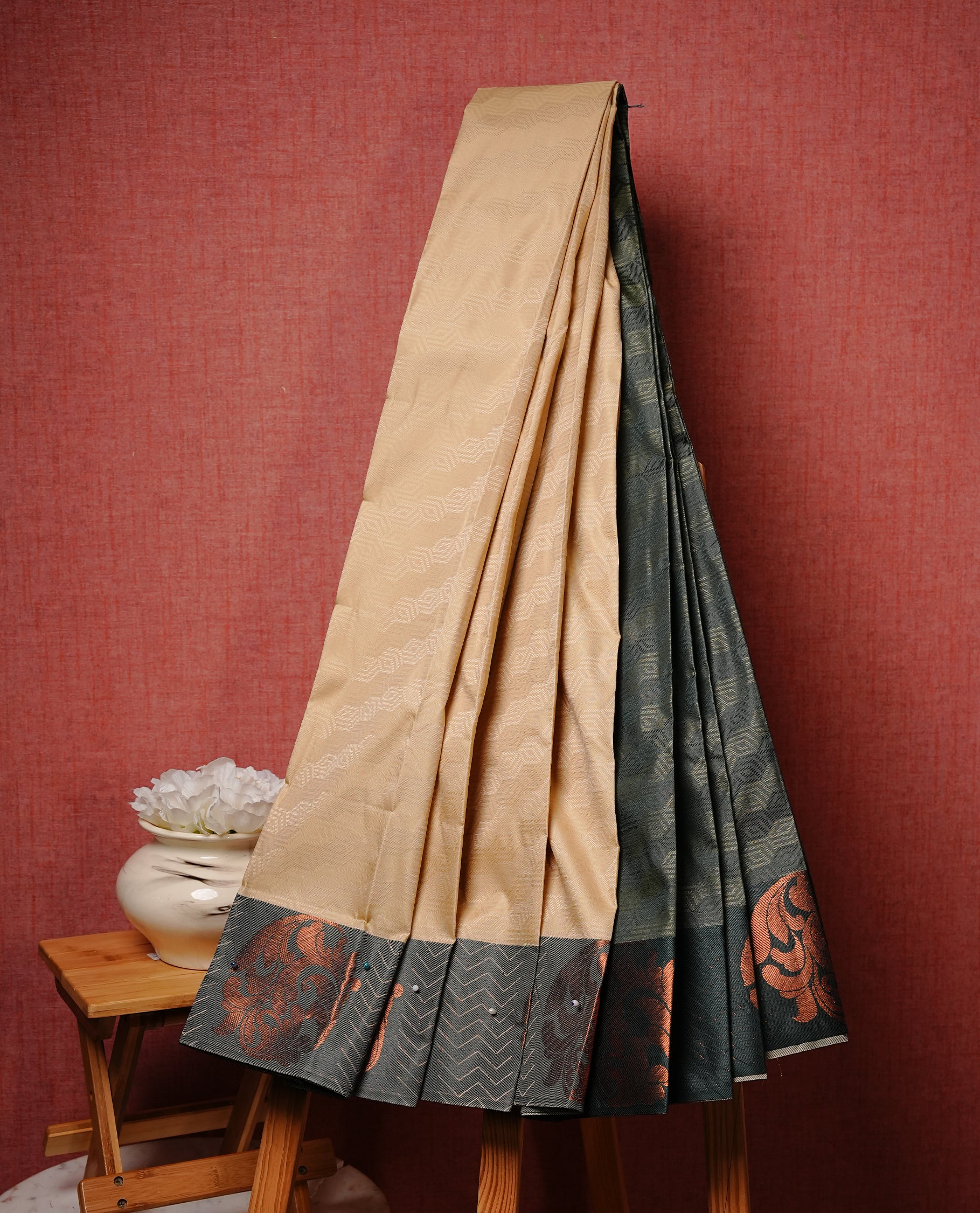 Light khaki colour Semi silk saree Featuring self colour zari Pattern on body, complemented by contrast Green colour with Antique zari border, paired with matching blouse piece.
