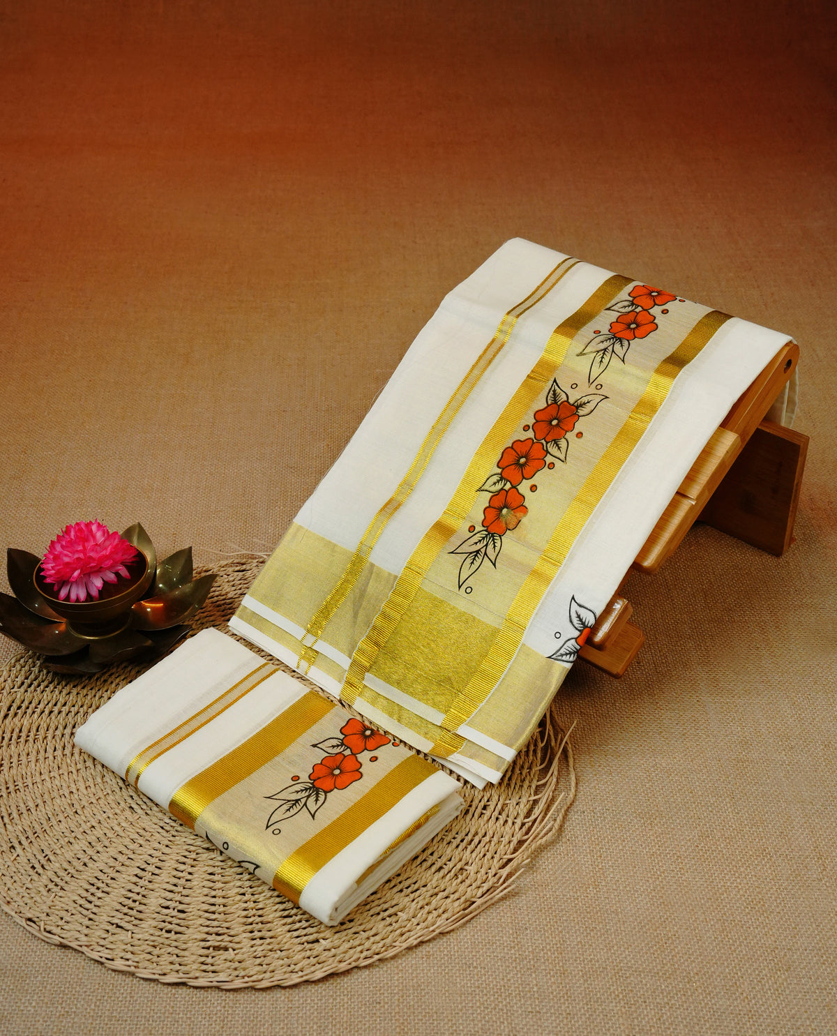 Cream colour cotton set mundu featuring Kasavu kara with floral print.