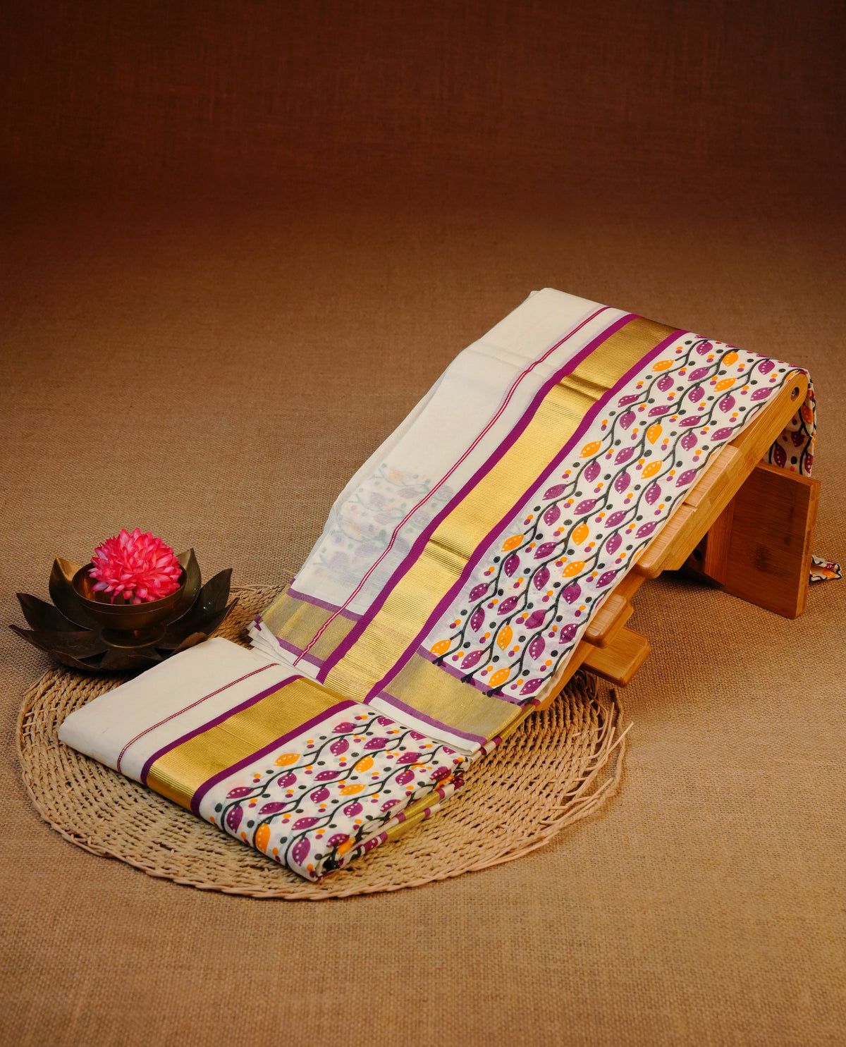 Cream colour cotton set mundu featuring Gold kasav with magenta Leaf kodi print kara.