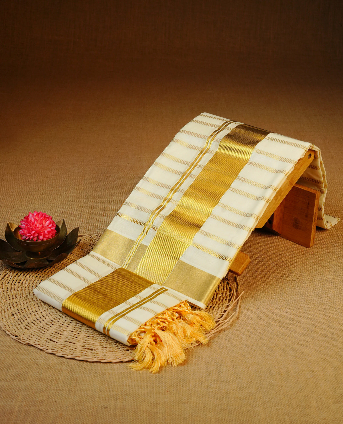 Cream colour cotton set mundu featuring strips on body, Gold kasav kara.