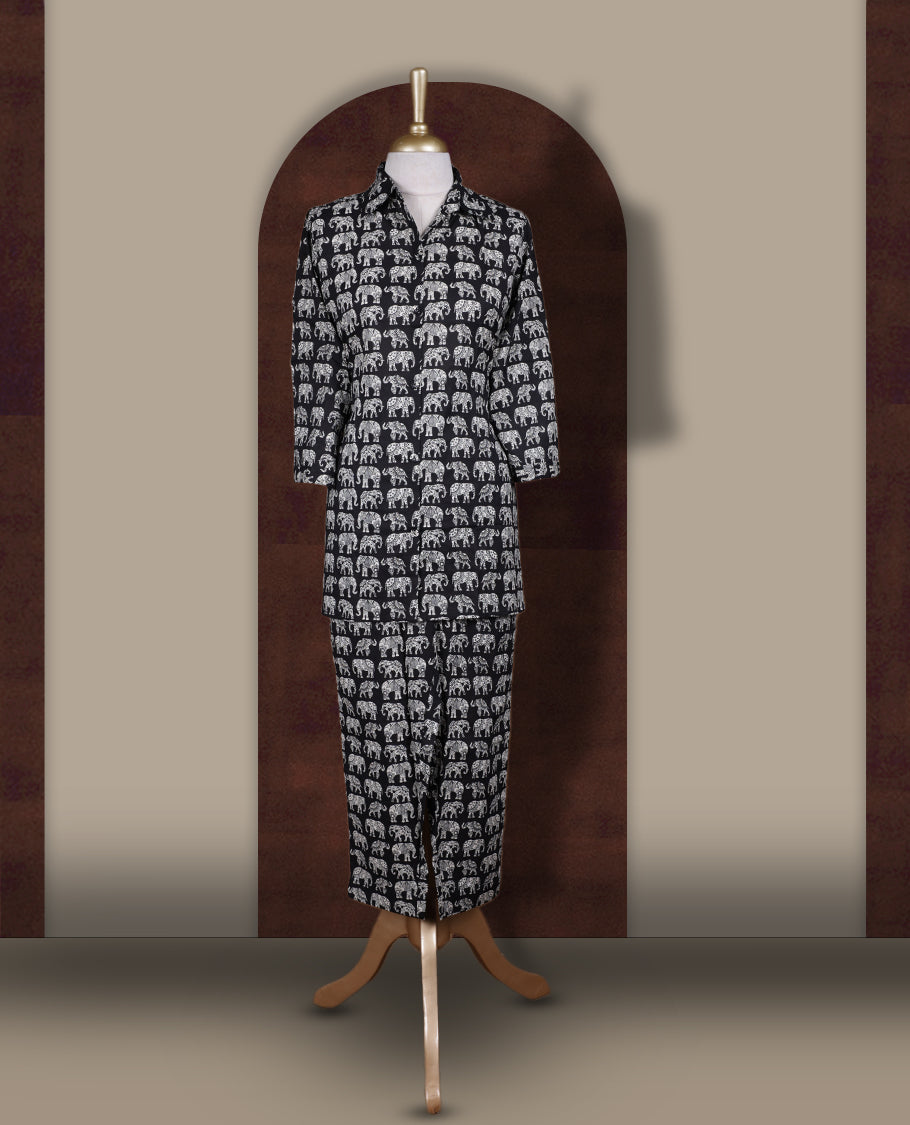 Black colour cotton coord set featuring charming elephant prints all over, Designed with a classic shirt collar and 3/4 sleeves, paired with matching straight pants for a trendy, relaxed, and comfy everyday look.