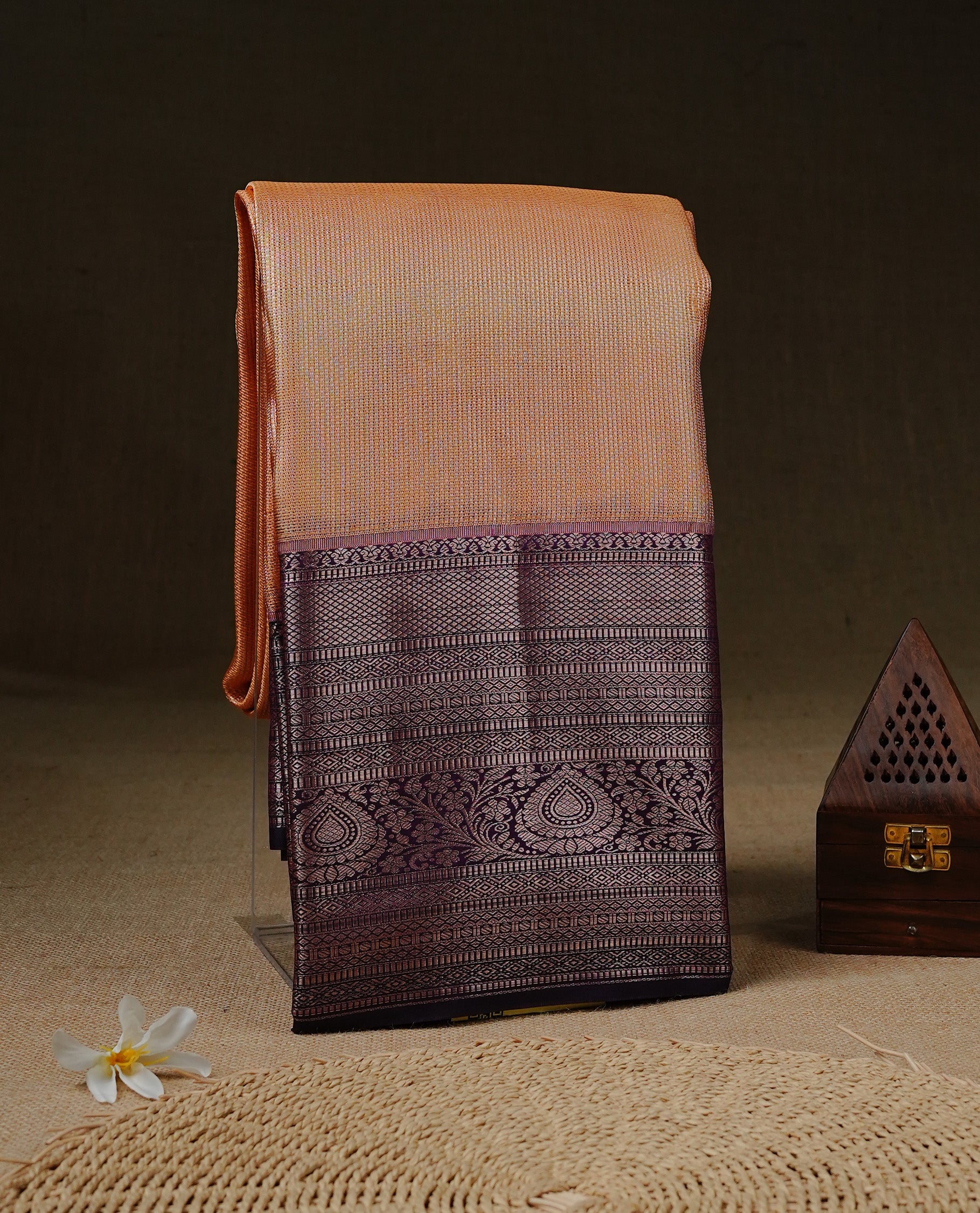 Peach cream colour Net Tissue saree Elegant plain body, complemented by Purple colour with Light gold zari traditional border, paired with matching blouse piece.