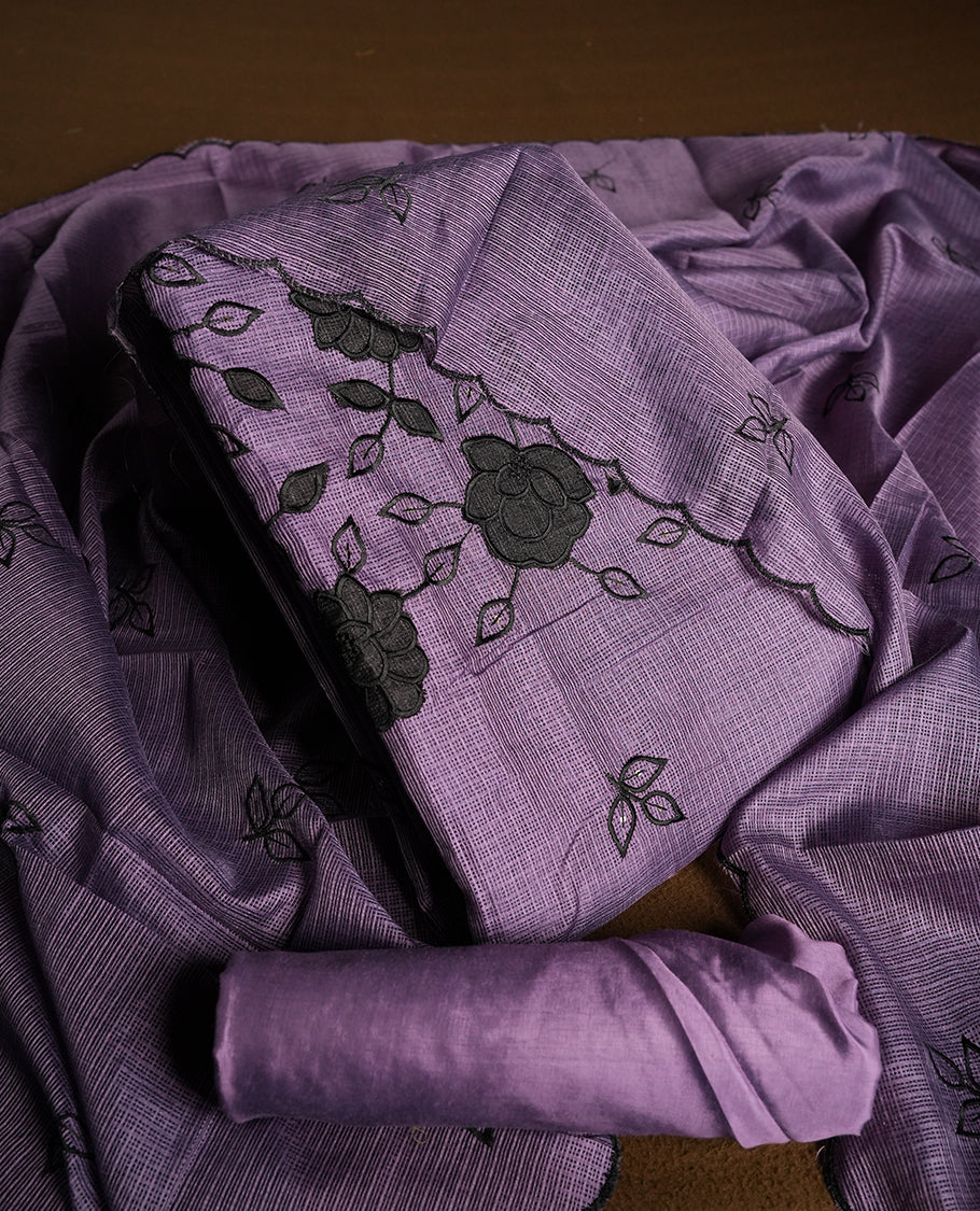 Purple colour churidhar material featuring Black colour thread embroidery on the front panel, self colour dupatta with elegant border, and matching plain bottom