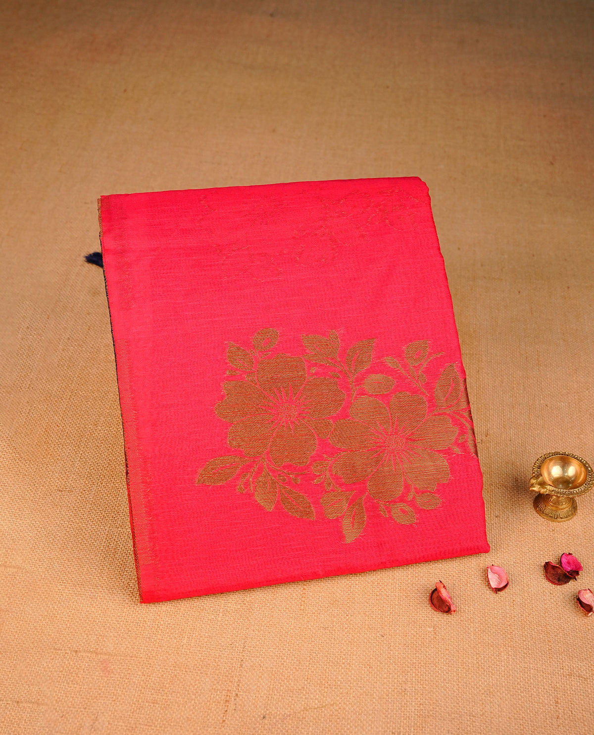 Pink colour semi linen saree with elegant gold zari floral motifs across the body, complemented by a contrast colour with grand gold zari pallu and a borderless design, paired with a matching blouse piece.