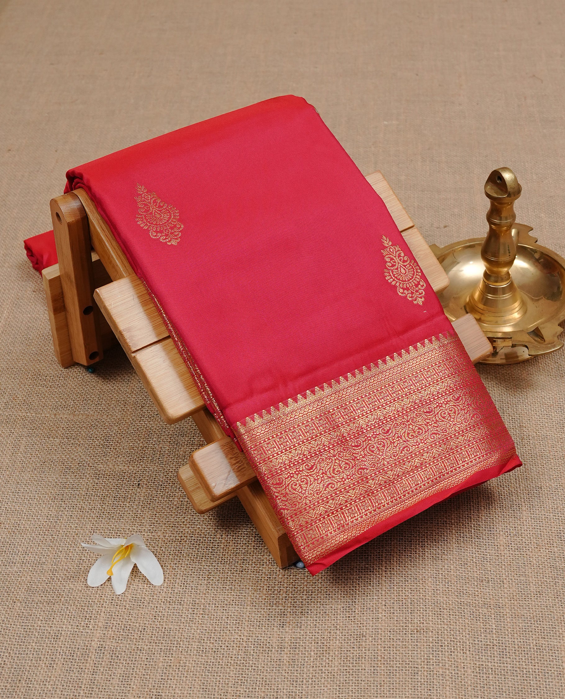 Red Semi Wedding Silk Saree featuring Gold Zari Motifs On body, Complemented with traditional zari with Self colour border, paired with matching blouse piece.