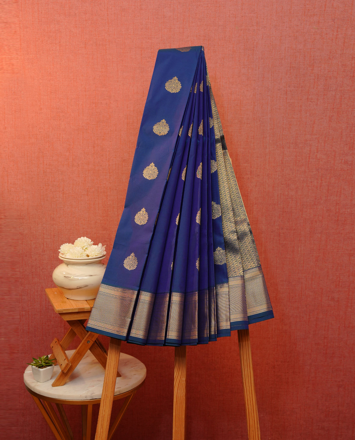 Blue & green doubleshade soft silk saree featuring gold zari floral motifs on body, contrast self colour gold zari traditonal border, grand pallu comes with matching blouse piece.