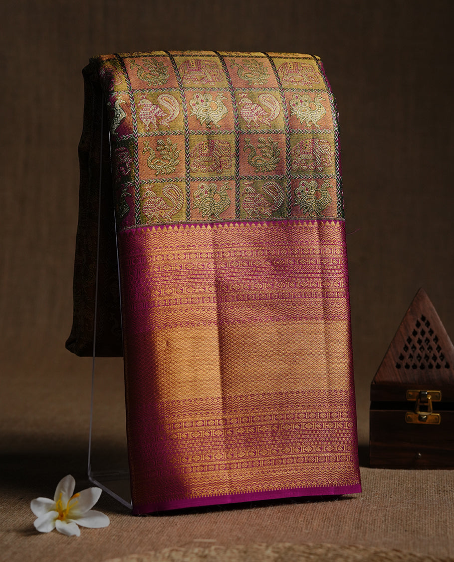 Gold, magenta, green multi colour kancheepuram tissue silk saree featuring gold zari Bird inside box pattern on body, complemented by contrast magenta colour with traditional border, paired with matching blouse piece.