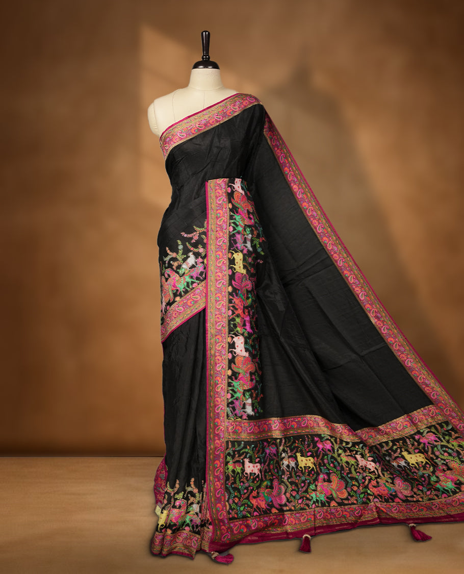 Black Pashmina Silk Saree with Plain Body, Accented by Vibrant Multicolor Embroidered Elephant, Horse, and Floral Motifs on Rich Pink-Green Zari Border & Grand Pallu, Paired with Matching Blouse Piece