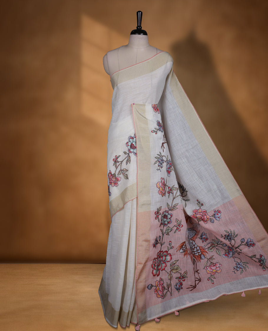 Cream colour cotton linen silk saree featuring Floral & brids printed pattern on body, golden simple border with Peach colour pallu and comes with a matching blouse