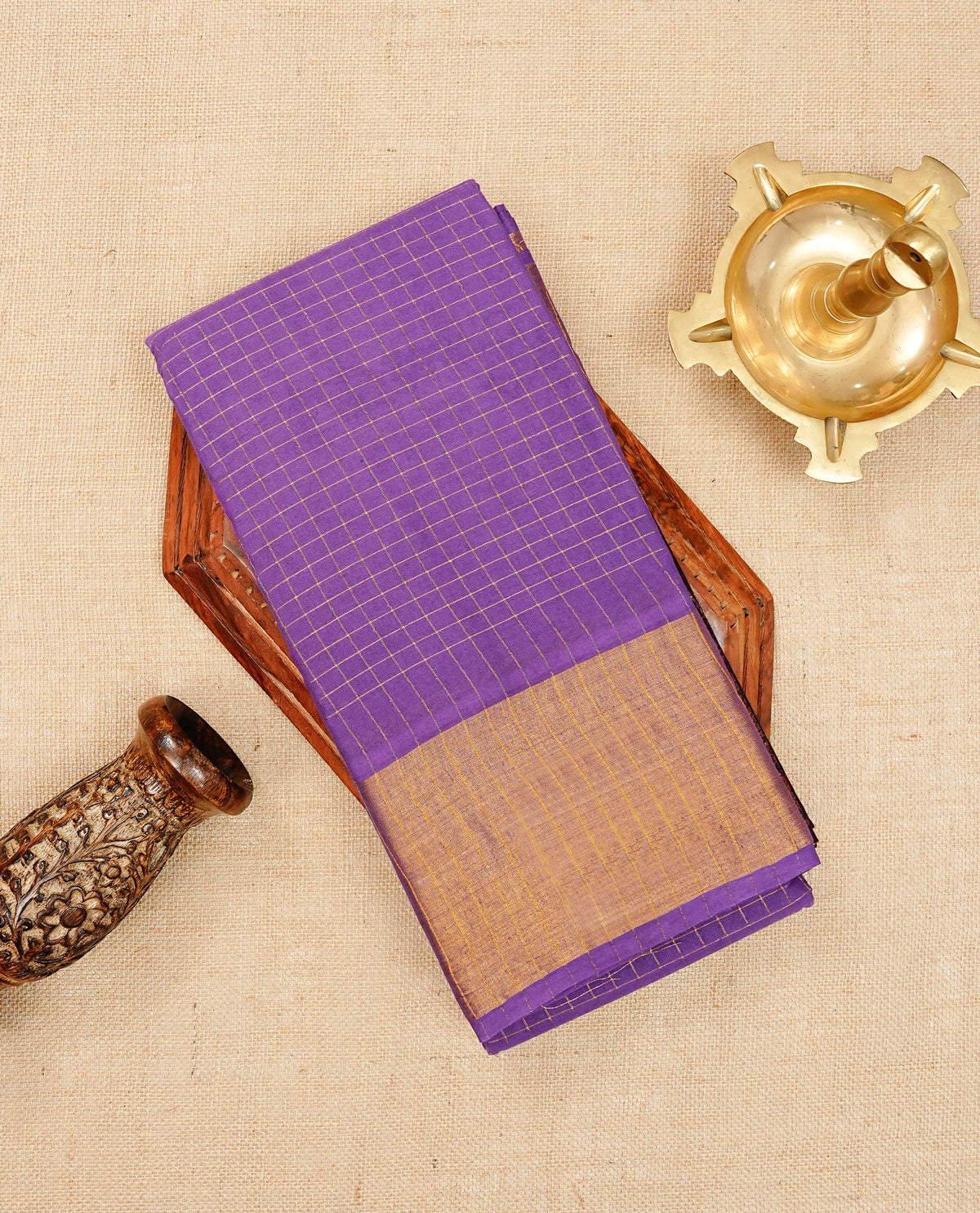 Violet Sungudi cotton saree featuring elegant gold zari checks across the body, complemented by a contrast gold zari border. Comes with a matching blouse piece.