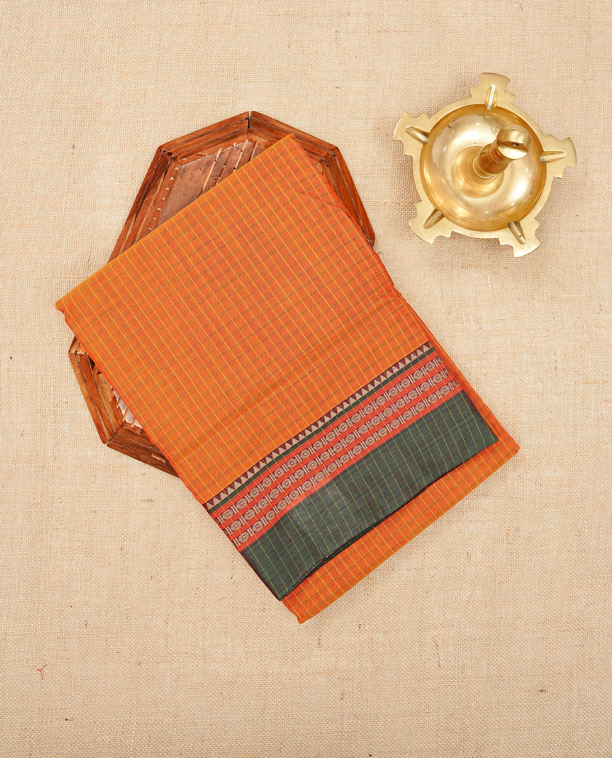 Orange colour Narayanapattu Cotton Saree featuring with a checked body, contrast grey temple design in green border, Contrast striped pallu, Paired with a matching blouse piece.