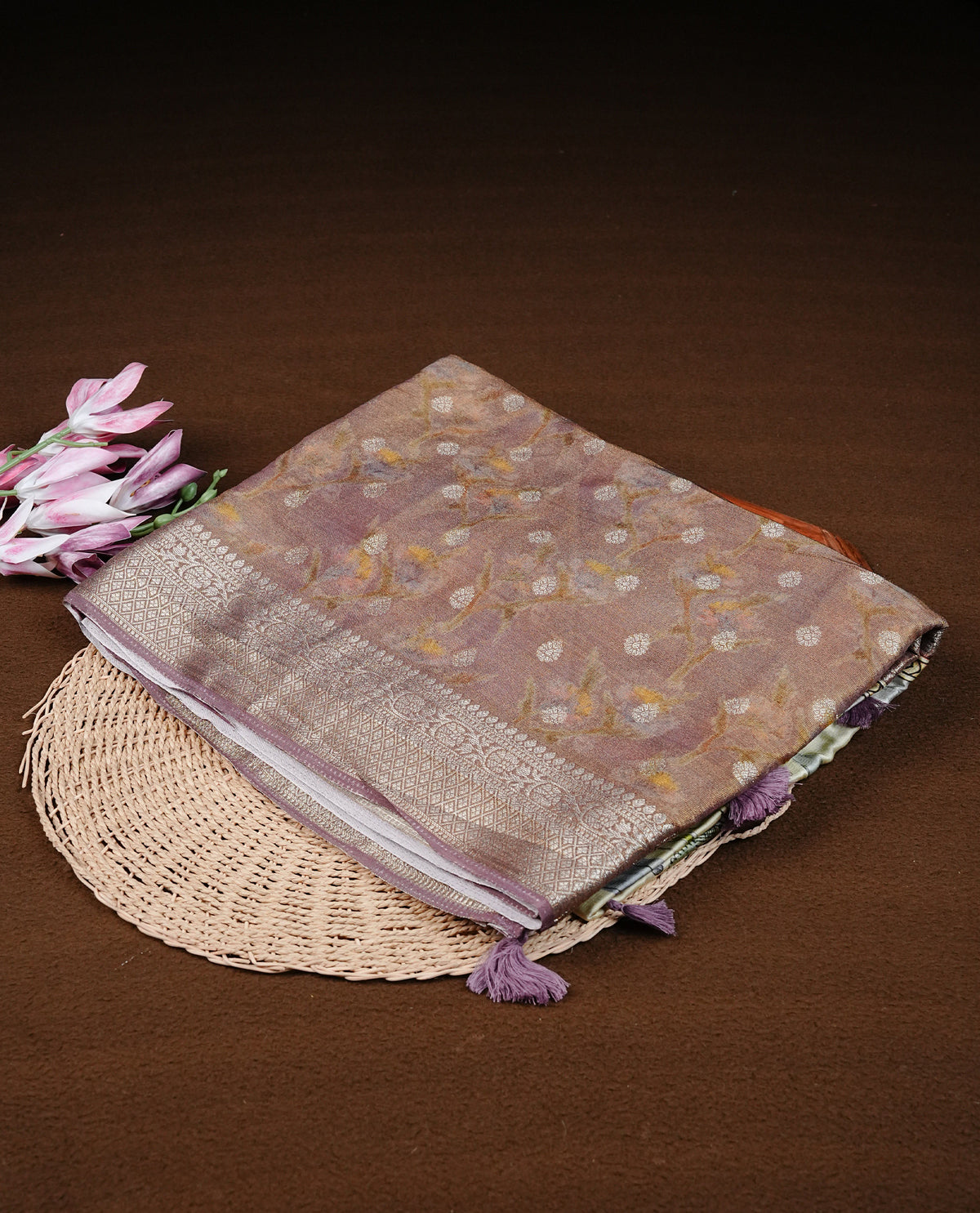 Light pink colour semi Banaras silk saree featuring with Digital printed body and traditional buttas on border, comes with matching blouse piece.