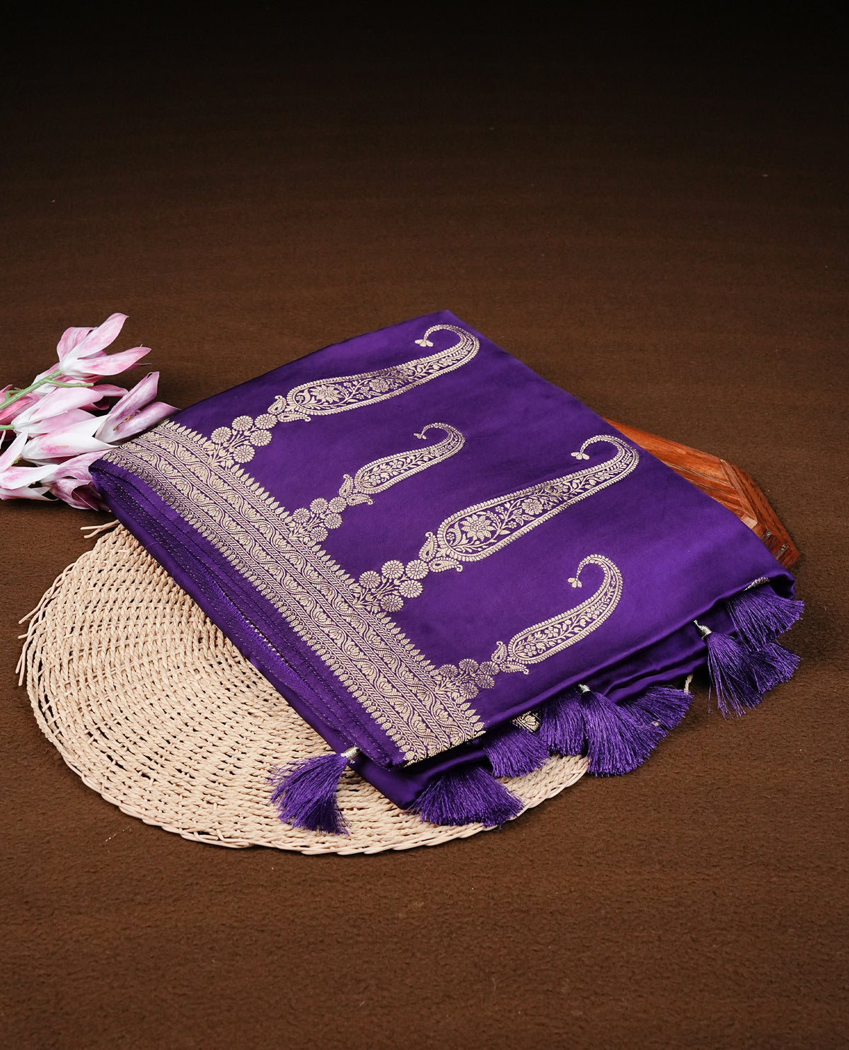 Violet colour Banaras satin crepe silk saree featuring Plain body, associate with Gold zari traditional border, comes with matching blouse piece.