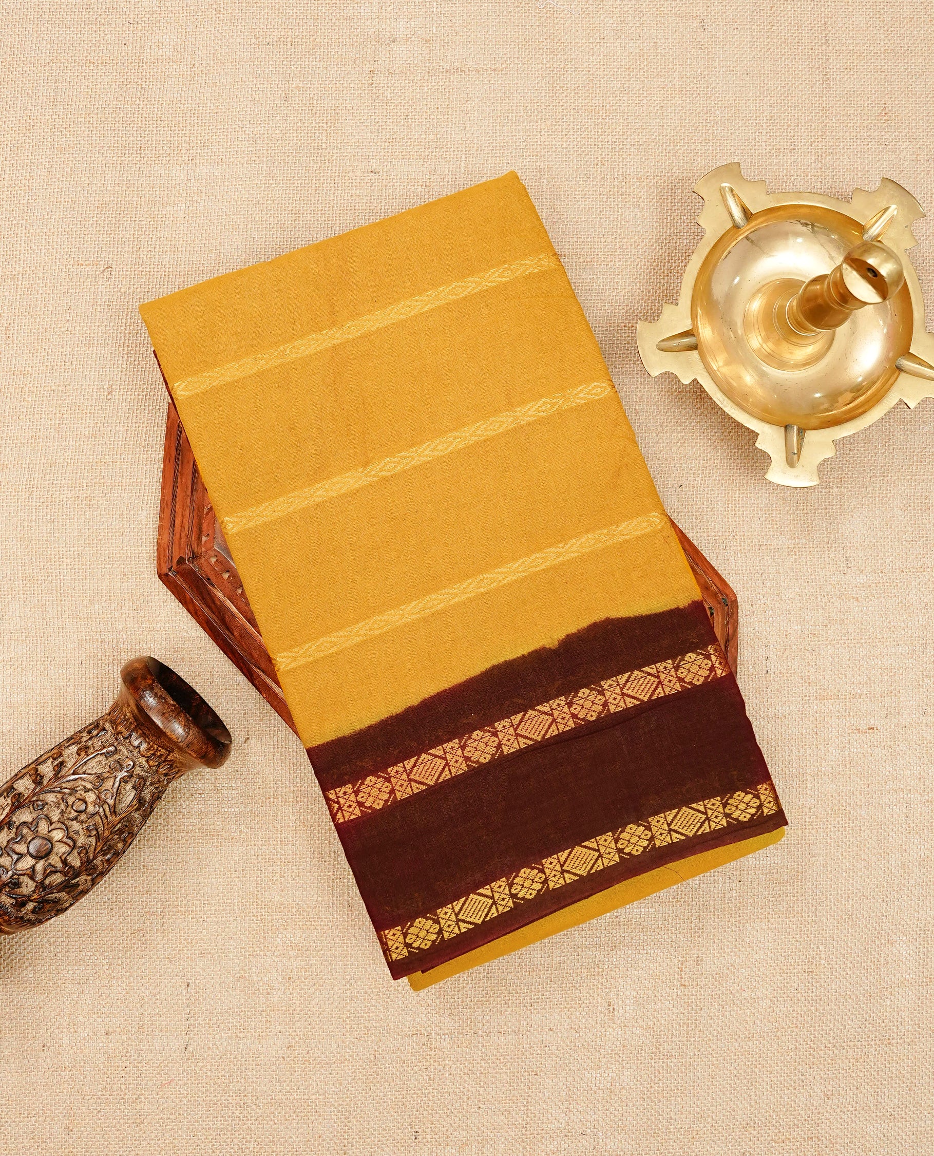 Mustard yellow colour Sungudi cotton saree featuring elegant gold zari stripes on the body, complemented by a contrast Maroon with gold zari border and pallu, paired with a matching blouse piece