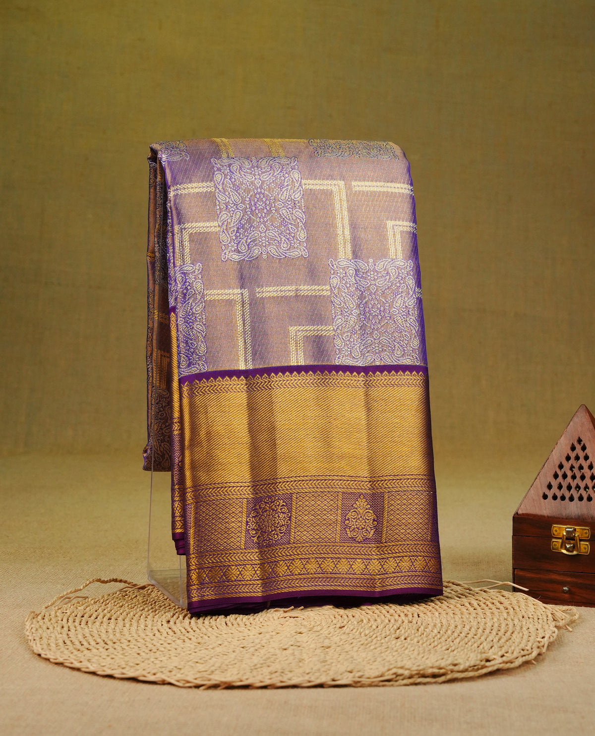Purple and Gold Double Shade pure tissue silk saree featuring zari Geometric pattern on body, complemented by Dark Purple colour traditional border, comes with matching blouse piece.