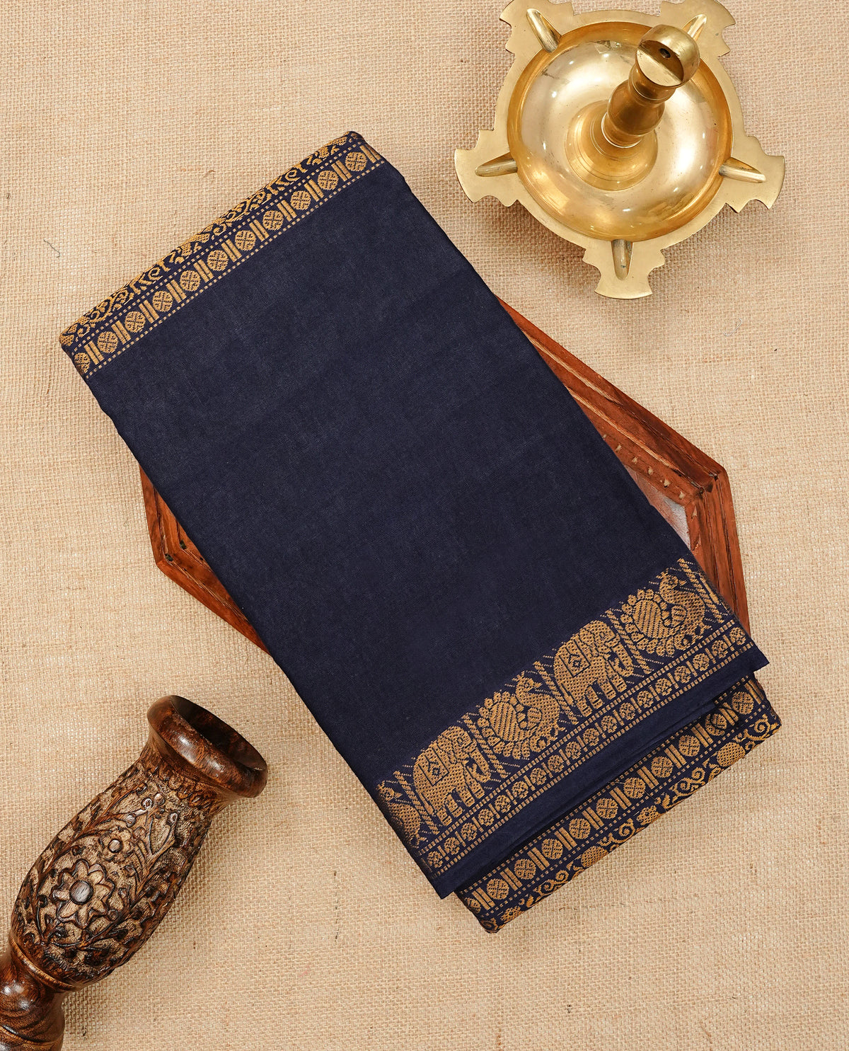Navy Blue Colour Sungudi Cotton Saree with gold zari elephant & Peacock motifs on the body, a self zari border, and a rich gold zari pallu. Paired with a Contrast Pink colour blouse Piece featuring a gold zari border.