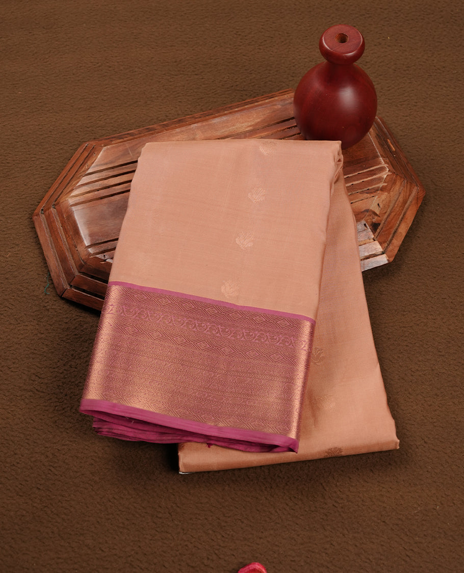 Sandalwood colour soft silk saree featuring gold zari motifs on the body, complemented by a contrast Magenta traditional zari border and pallu, paired with a matching blouse piece.