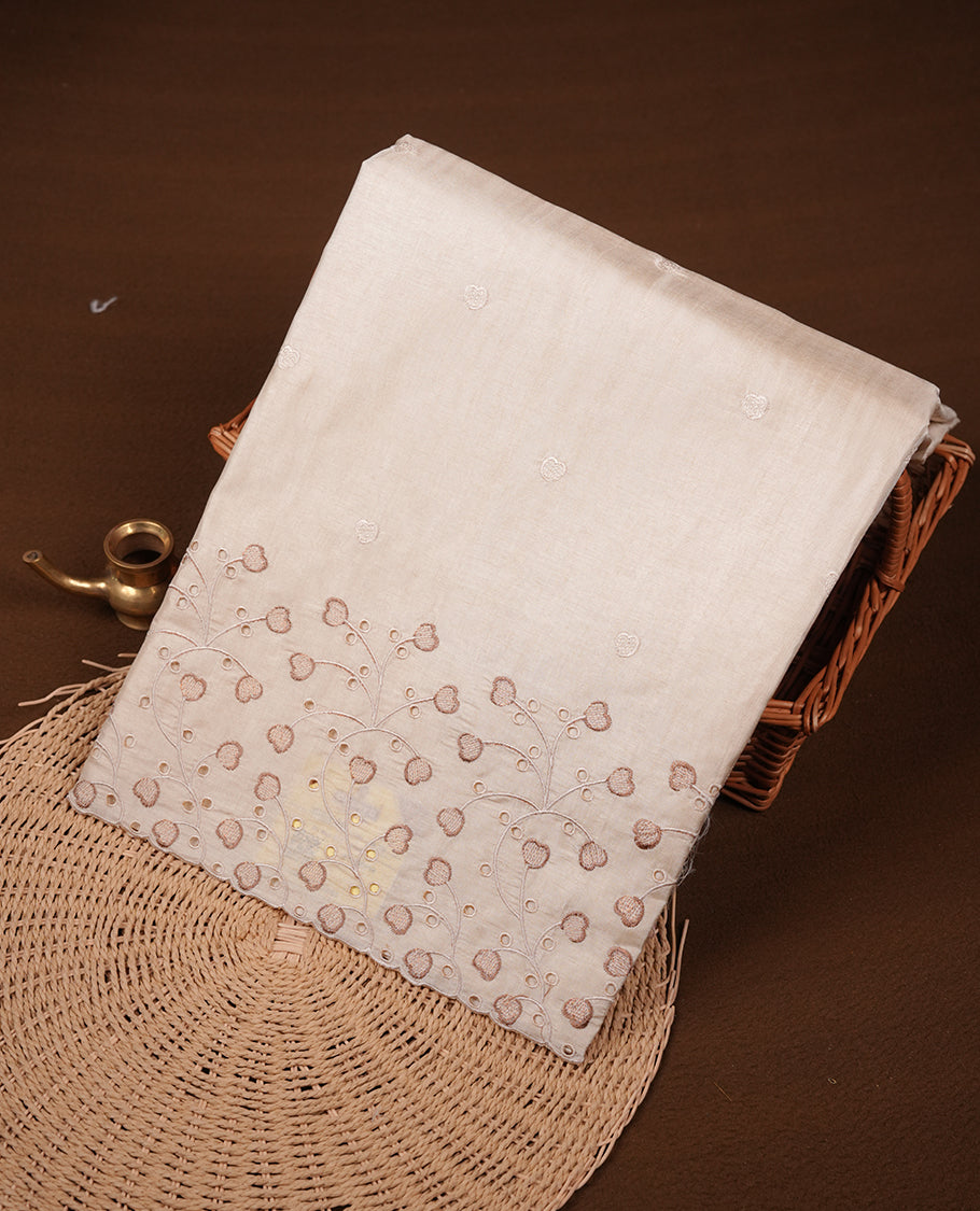 Beige colour Tussar silk saree featuring Elegant plain body, highlighting Brown colour thread floral kodi worked scalp border, pallu and paired with matching blouse piece.