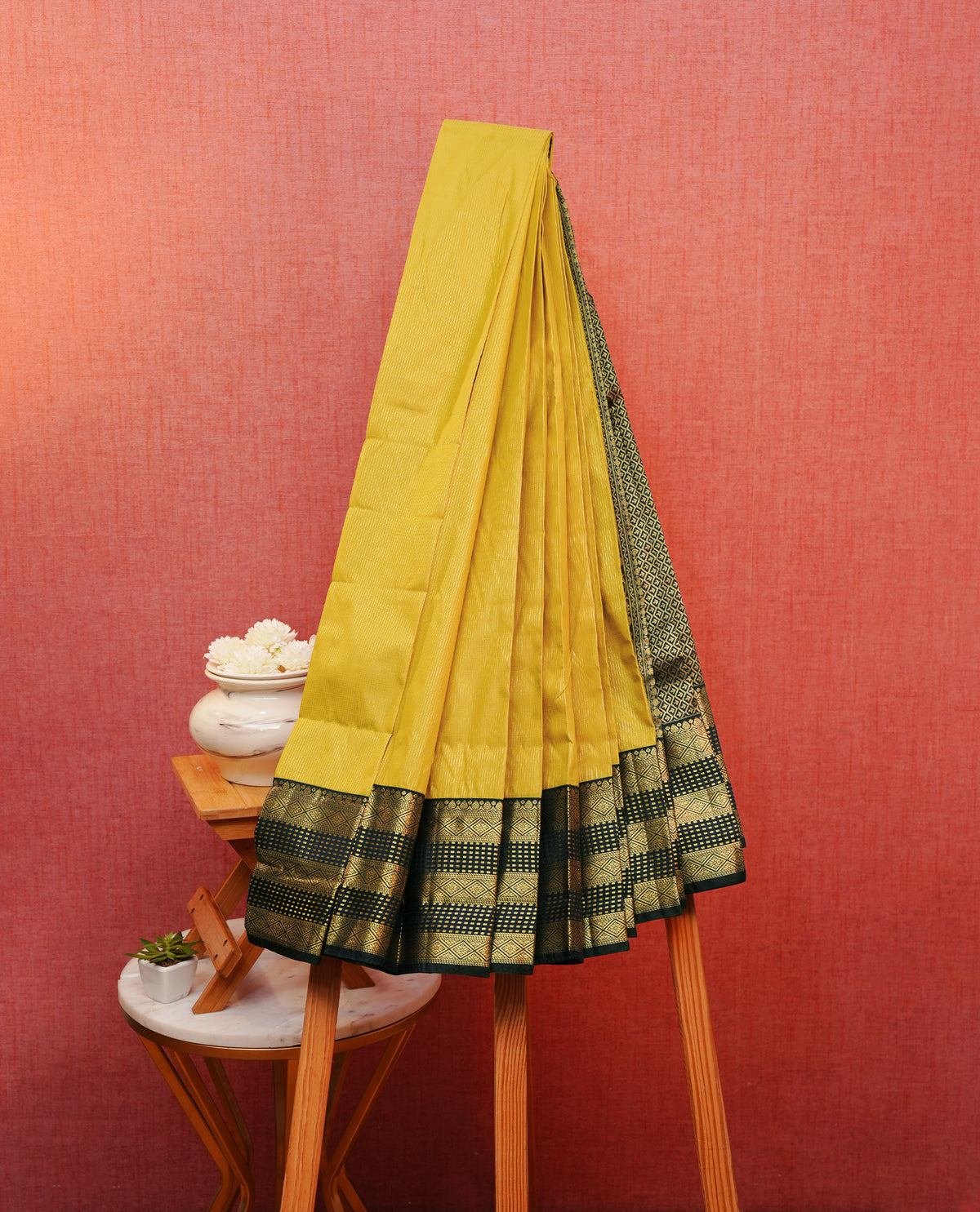 Mustard yellow colour silk saree featuring gold zari stipes on body, contrast navy blue with gold zari traditional border, contrast grand pallu comes with matching blouse piece .