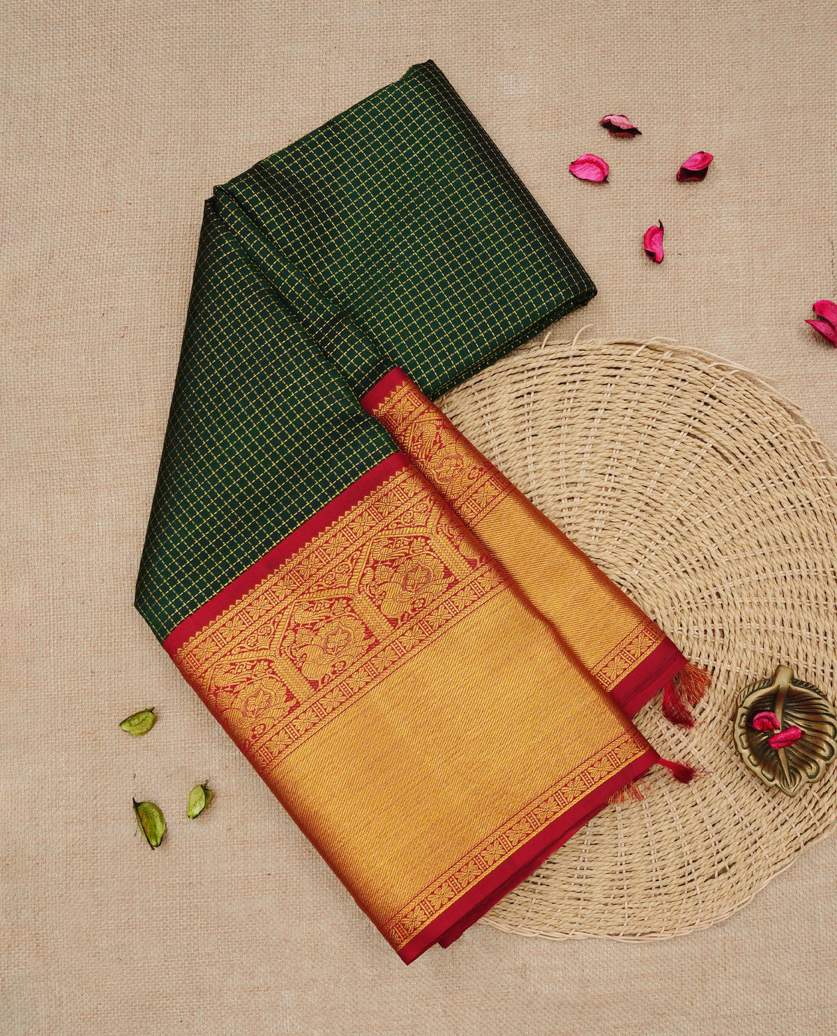 Bottle green colour Traditional Kancheepuram silk saree featuring Gold zari dotted checks on body, complemented by contrast maroon colour with traditional border, comes with matching blouse piece.