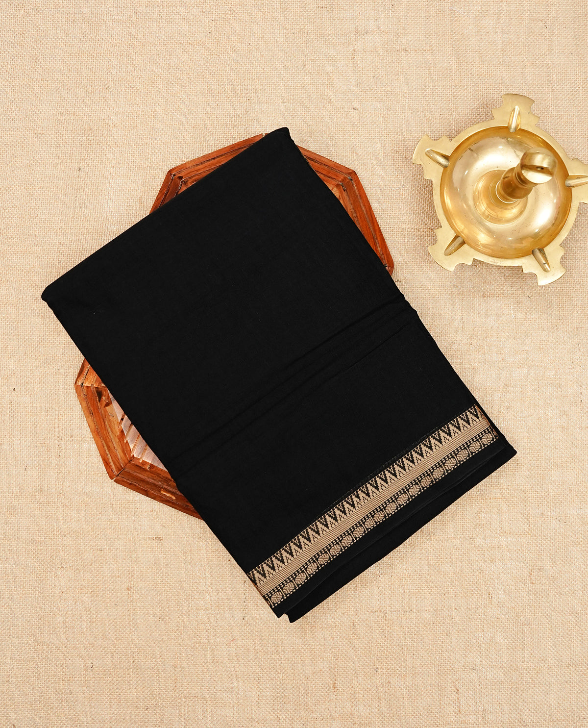 Black colour Narayanapattu cotton saree Featuing a plain body, complemented by a beige colour temple designed border & contrast pallu, paired with a matching blouse piece